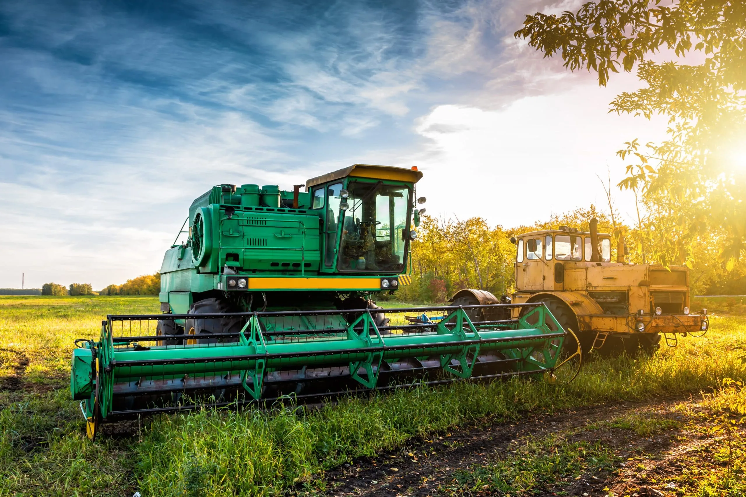 KSA Agricultural Equipment Market Outlook to 2030 modern-green-combine-harvester-yellow-heavy-duty-tractor-agricultural-field-rays-autumn-sun-1-scaled