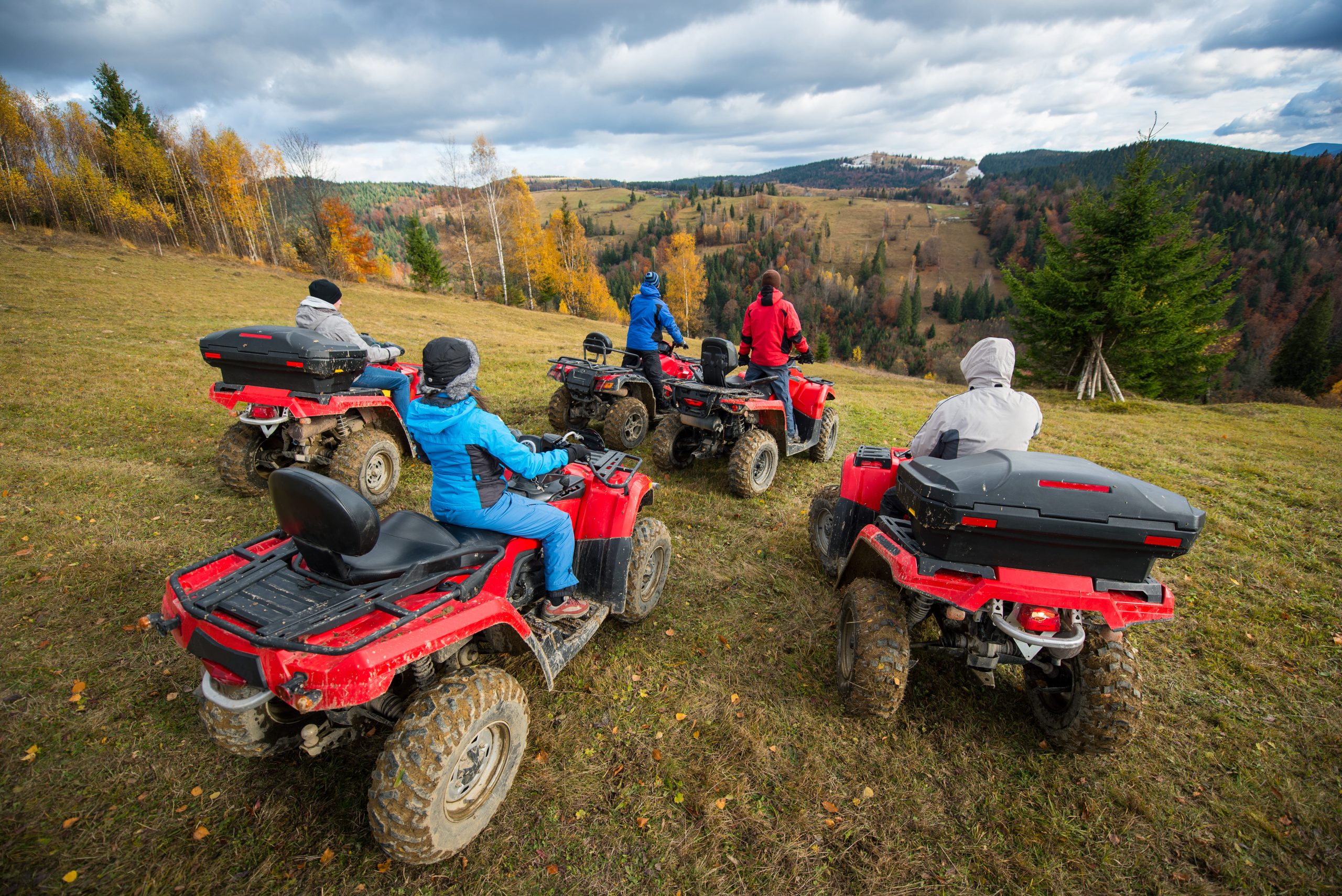 rear-view-group-five-person-riding-quad-bikes-hill-enjoying-beautiful-autumn-scenery-1-scaled