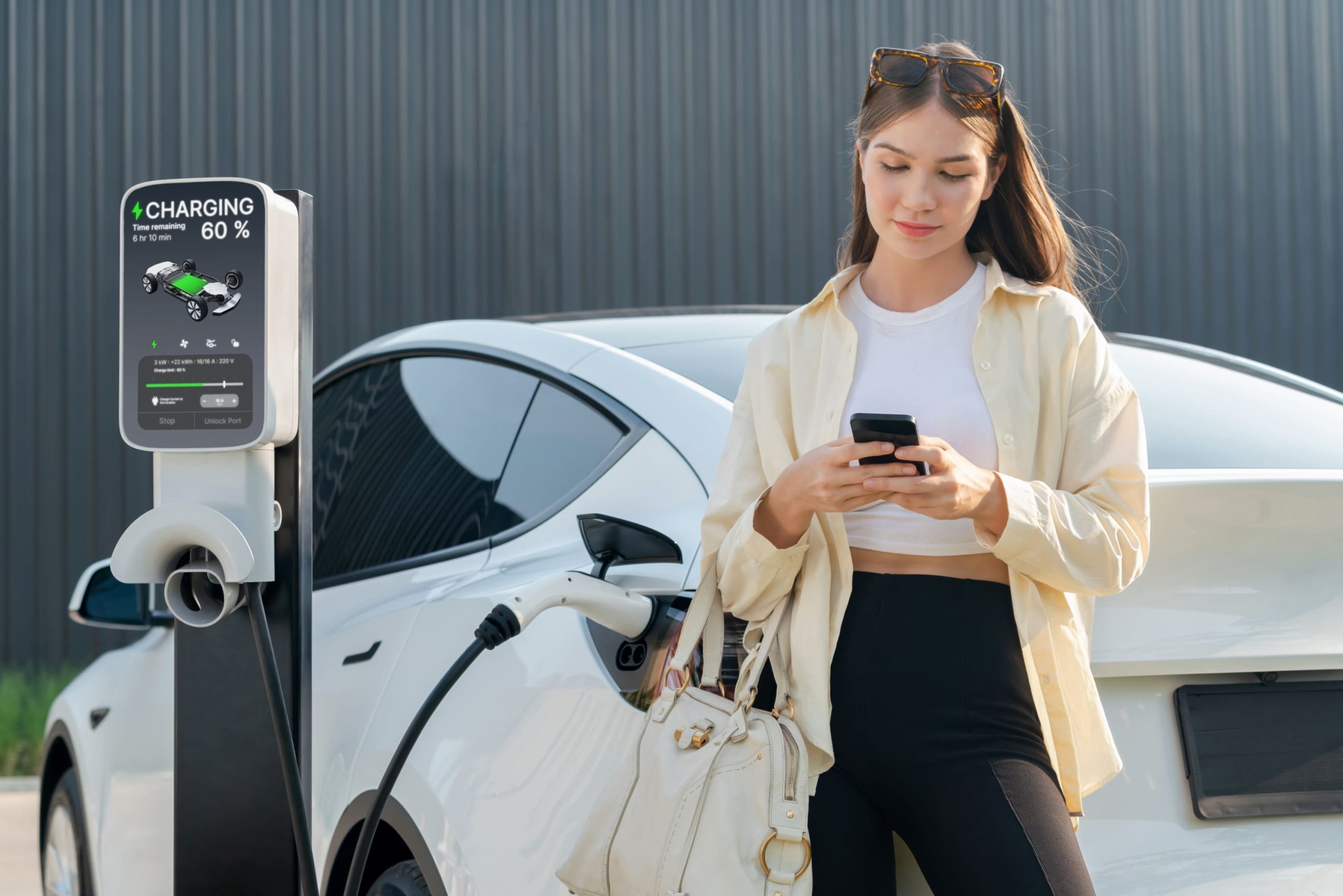 young-woman-holding-shopping-bag-recharge-ev-car-expedient-1-scaled