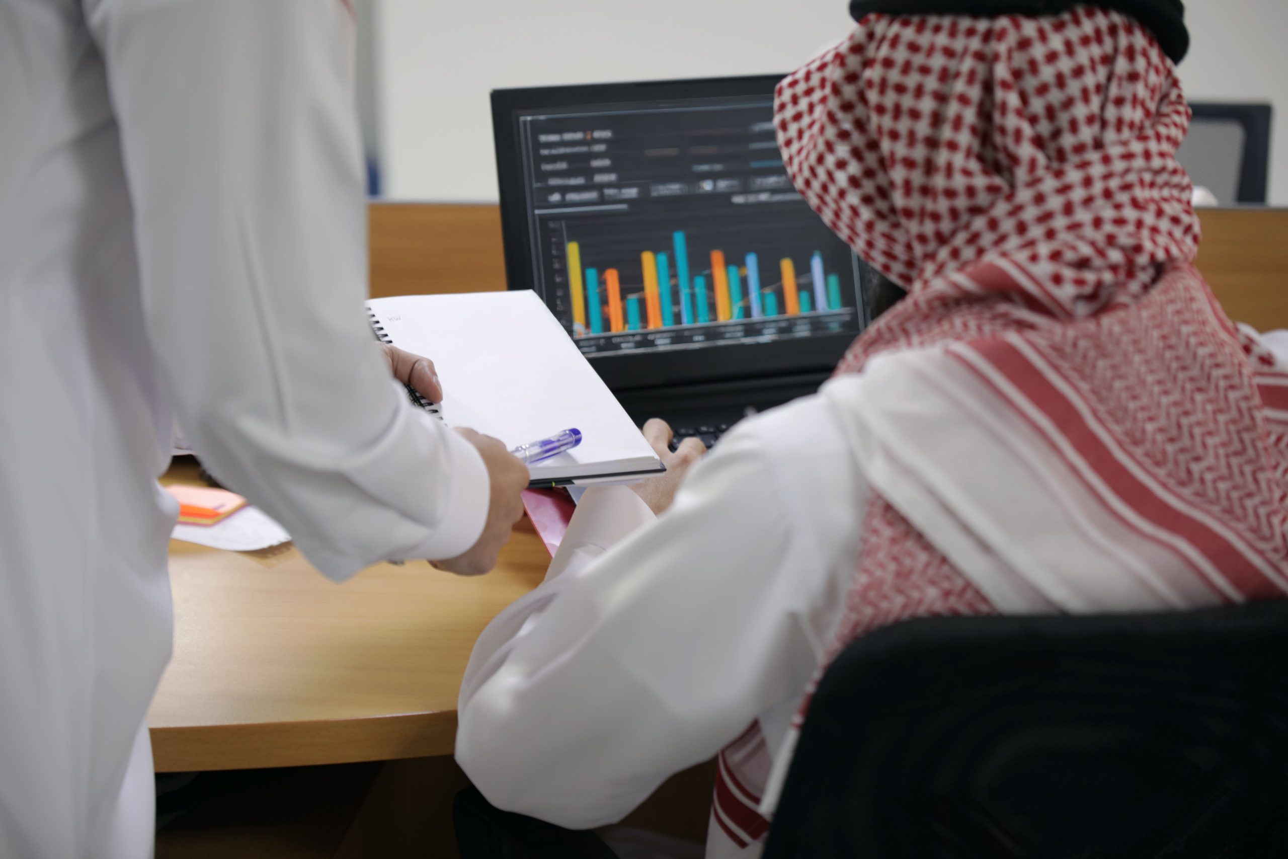KSA Virtual Consultations Market Outlook 2030 arabs-working-office-businesspeople-laptop-documents-1-scaled