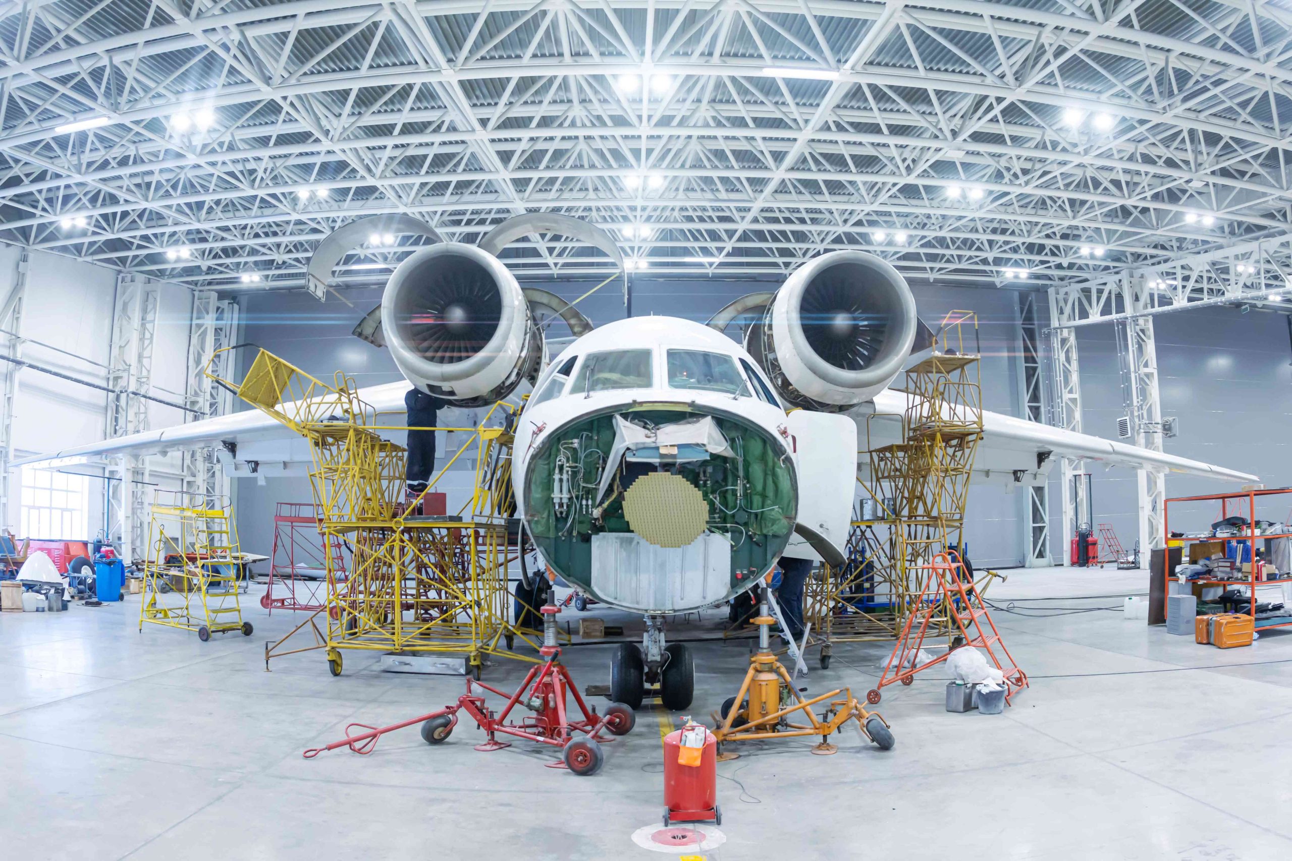 Qatar aircraft electrical systems Market outlook to 2035 front-view-white-transport-airplane-hangar-aircraft-maintenance_compressed-scaled