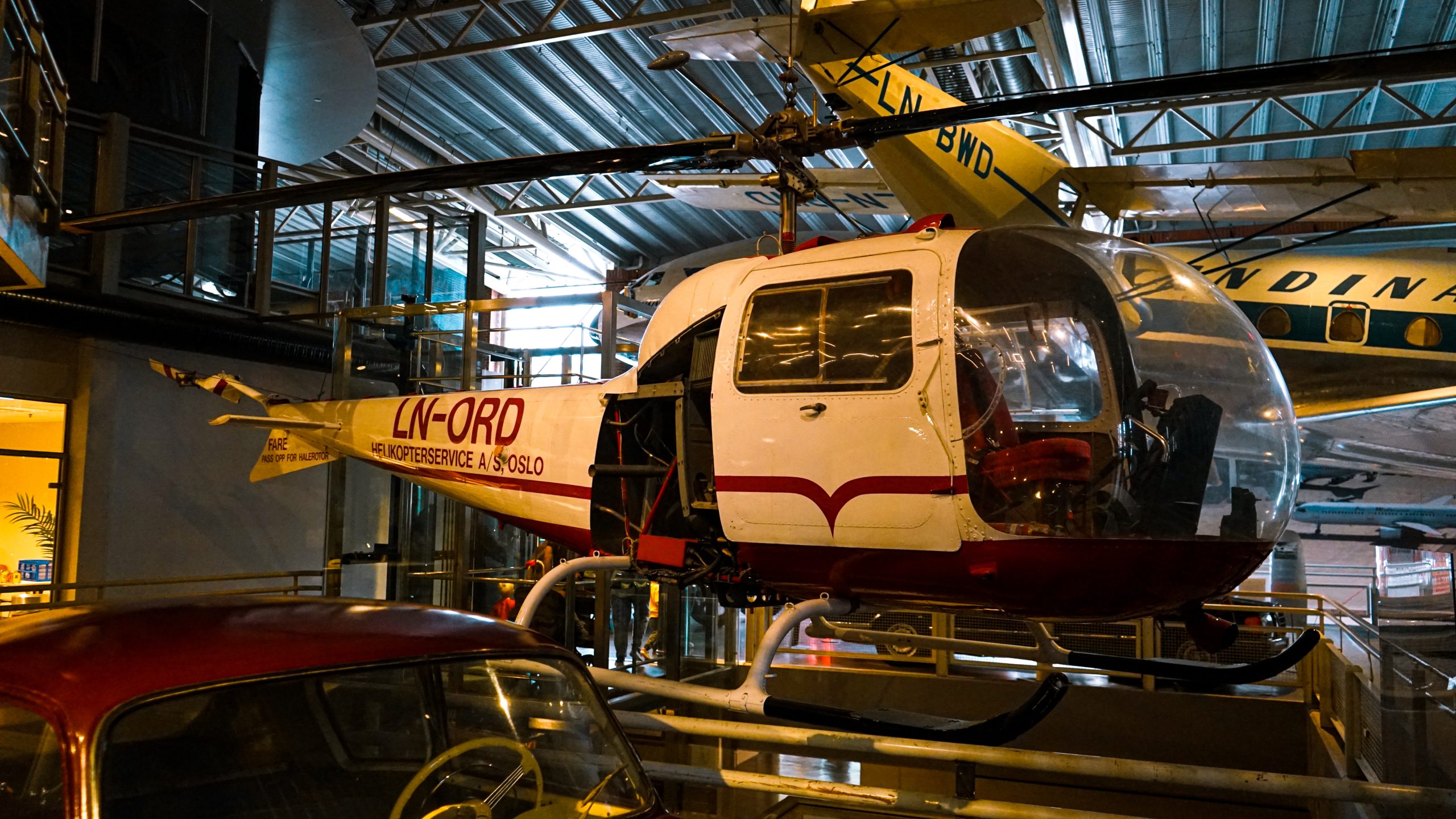 helicopter-with-red-white-sign-that-says-ford-it-1-scaled
