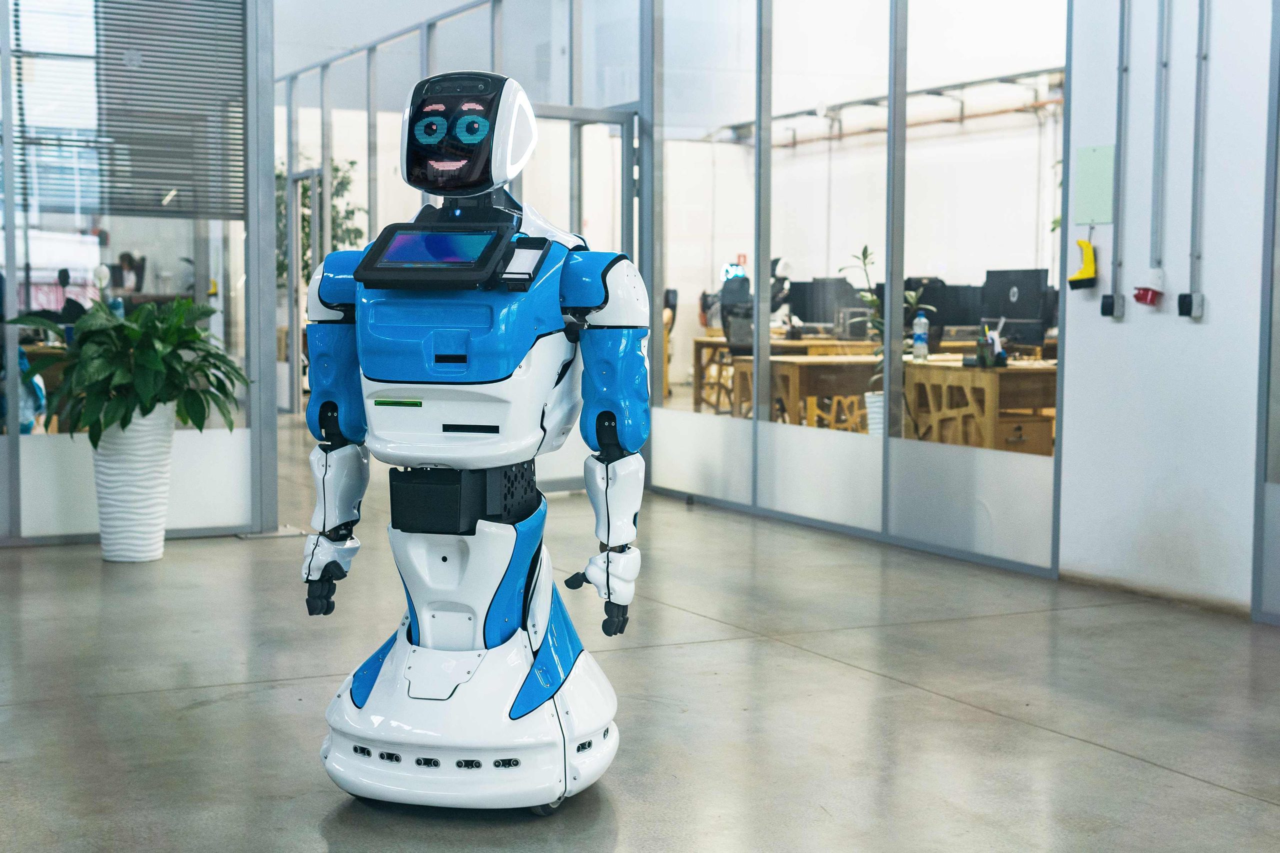 humanoid-robot-with-friendly-face-interior-modern-office_compressed-scaled