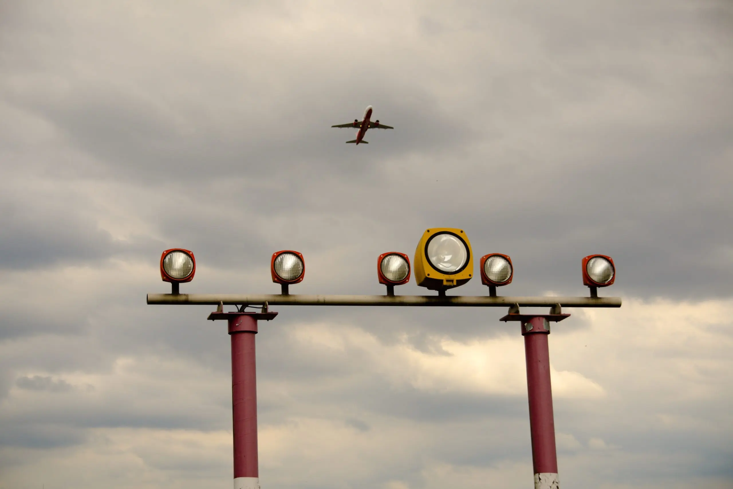 US Air Traffic Management Market Outlook to 2035 low-angle-view-airplane-flying-lighting-equipment-against-cloudy-sky-scaled