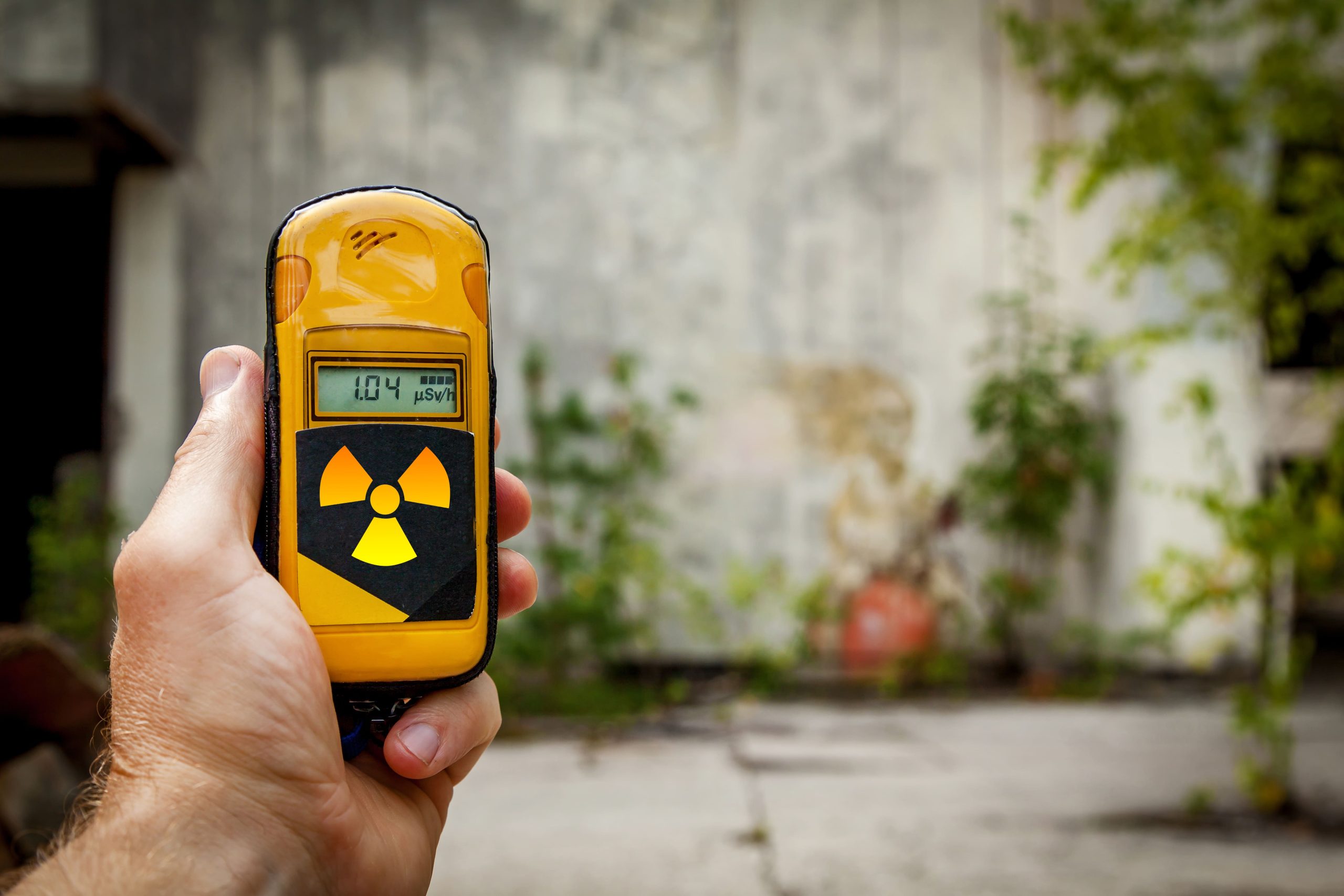 India explosive trace detection Market outlook to 2035 man-holding-yellow-instrument-measuring-level-radiation-background-1-scaled