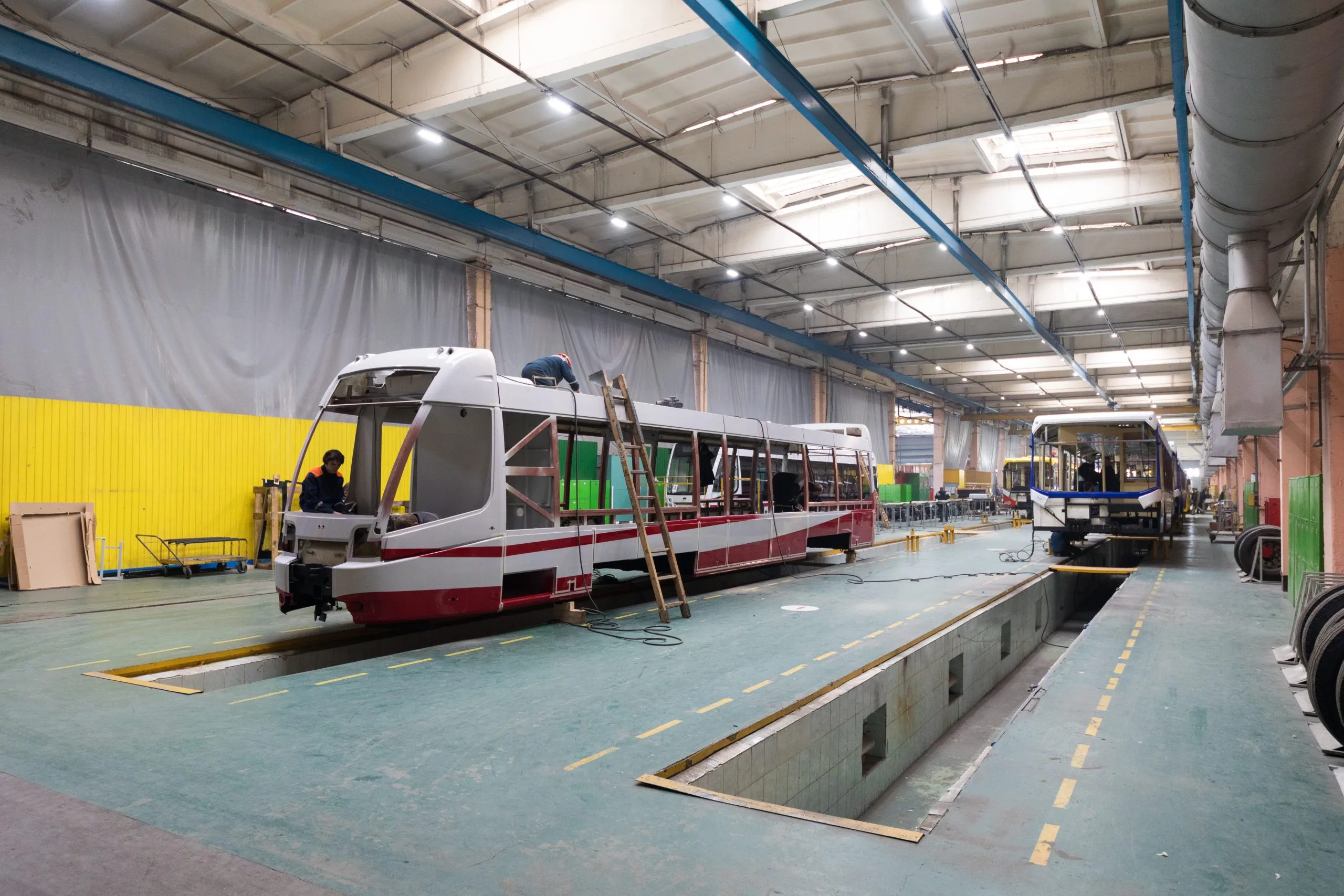 Qatar helicopter services Market outlook to 2035 one-working-day-modern-automatic-bus-trolleybus-car-production-with-unfinished-cars-workers-protective-uniform-automotive-background-automobile-assembly-line-1-scaled