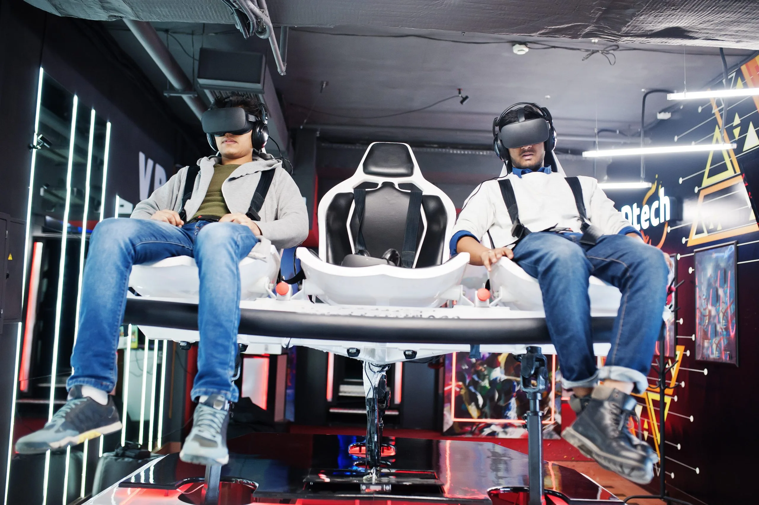 Qatar helicopter simulator Market outlook to 2035 two-young-indian-people-having-fun-with-new-technology-vr-headset-virtual-reality-simulator-1-scaled