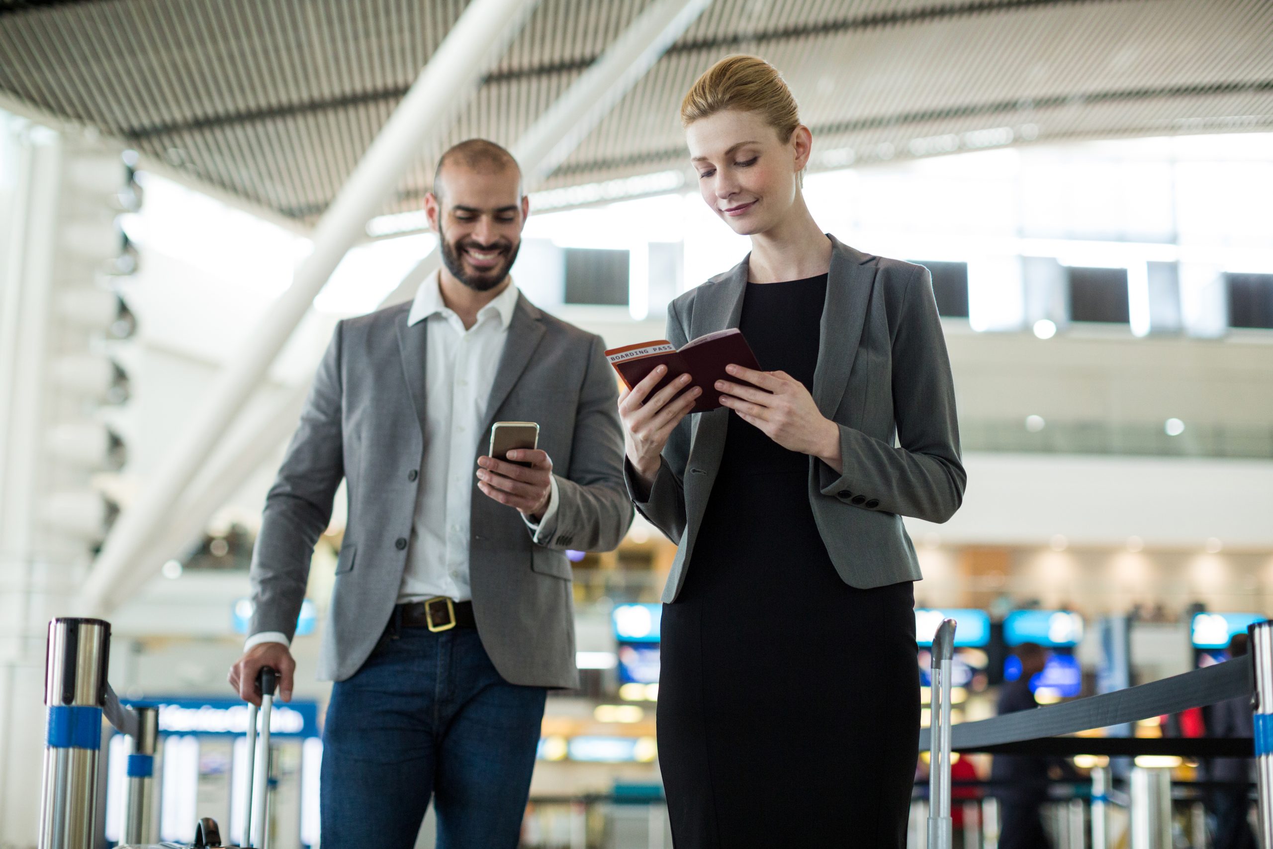 US in flight entertainment and connectivity Market outlook 2035 businesspeople-waiting-queue-check-counter-with-luggage-scaled