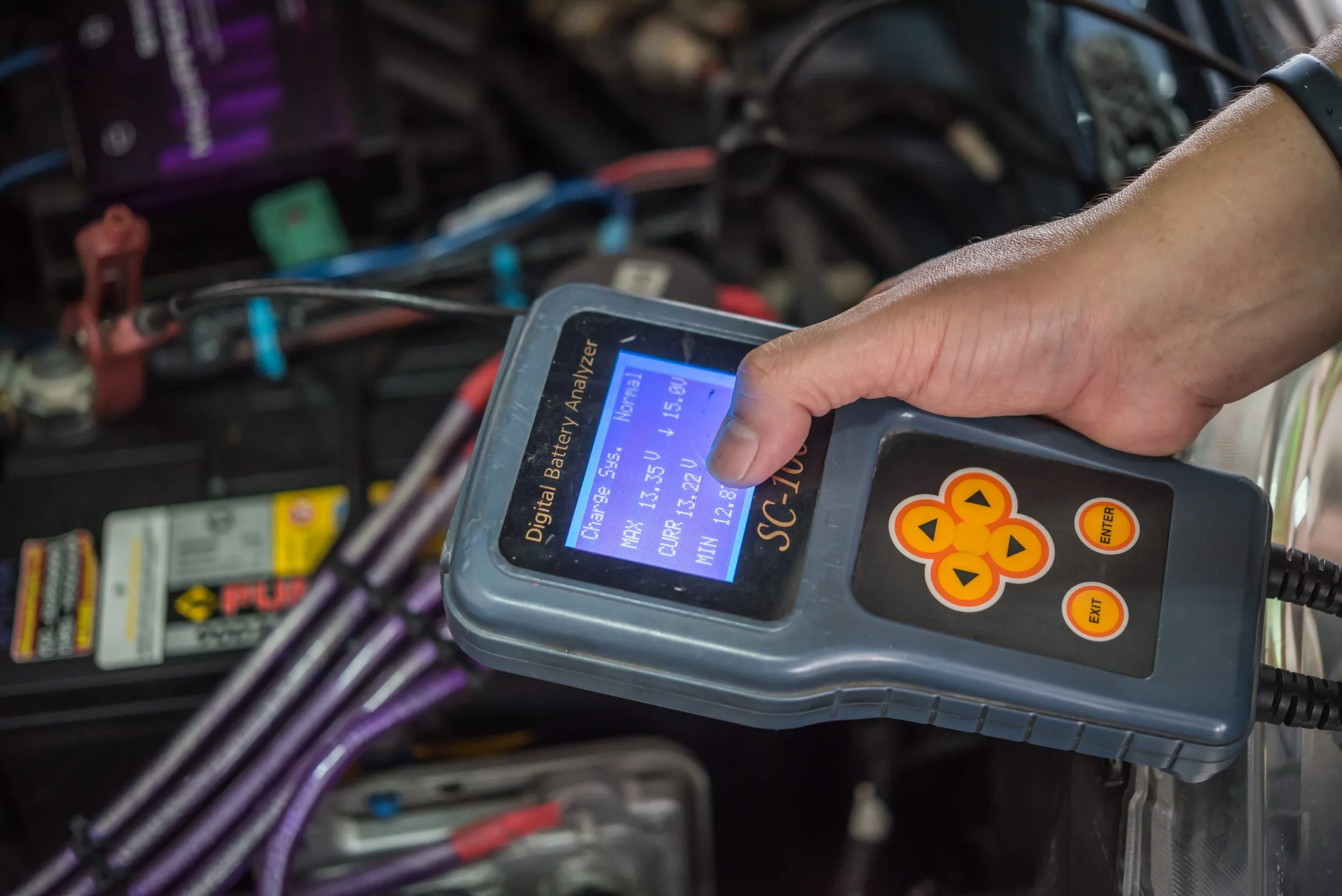 USA EV Thermal Interface Materials Market Outlook 2030 car-mechanic-serviceman-checking-car-battery-scaled