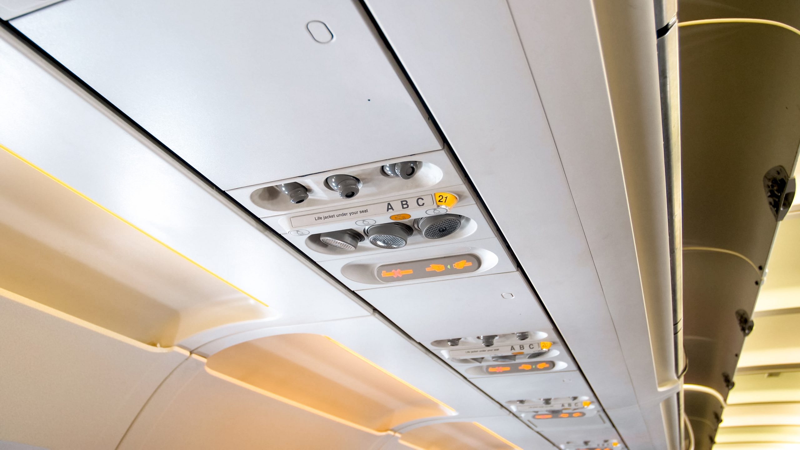 Middle east commercial aircraft cabin lighting Market outlook 2035 closeup-view-ceiling-airplane-with-lights-controls-scaled