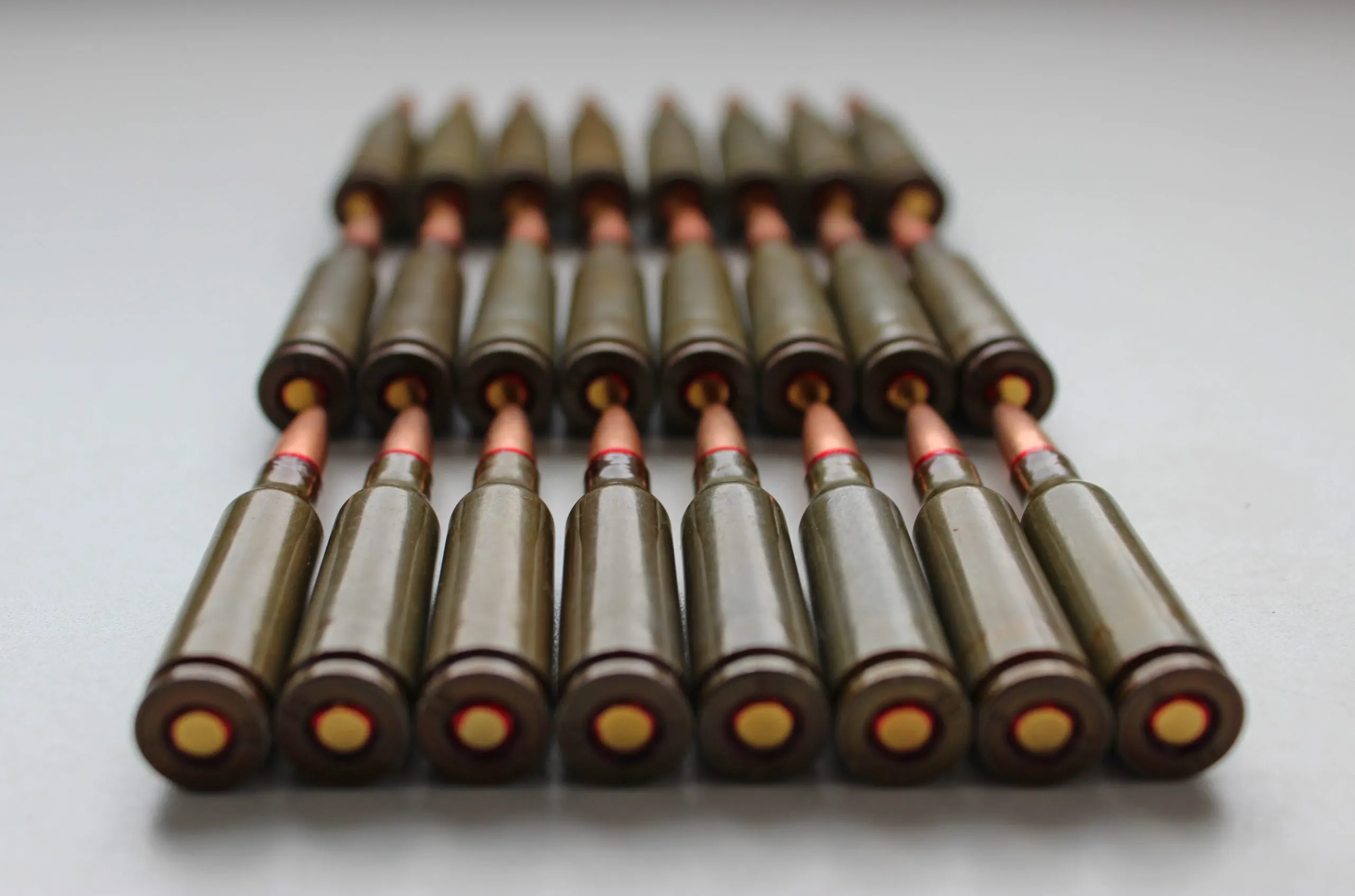 Israel Loitering Munition Market Outlook to 2035 closeup-view-live-ammunition-capsules-assault-rifle-laid-out-rows-white-background-scaled