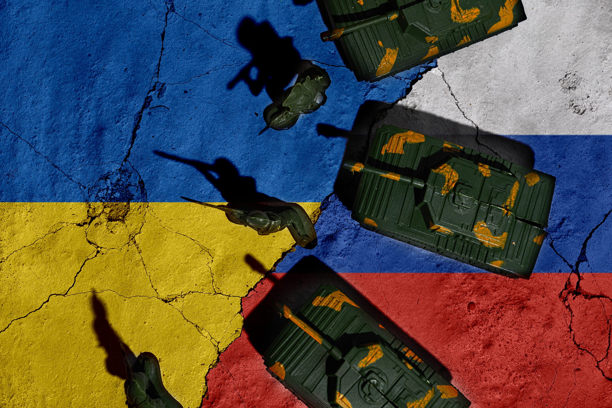 conflict-russia-ukraine-grunge-flags-russia-ukraine-with-soldiers-shadows-1-scaled