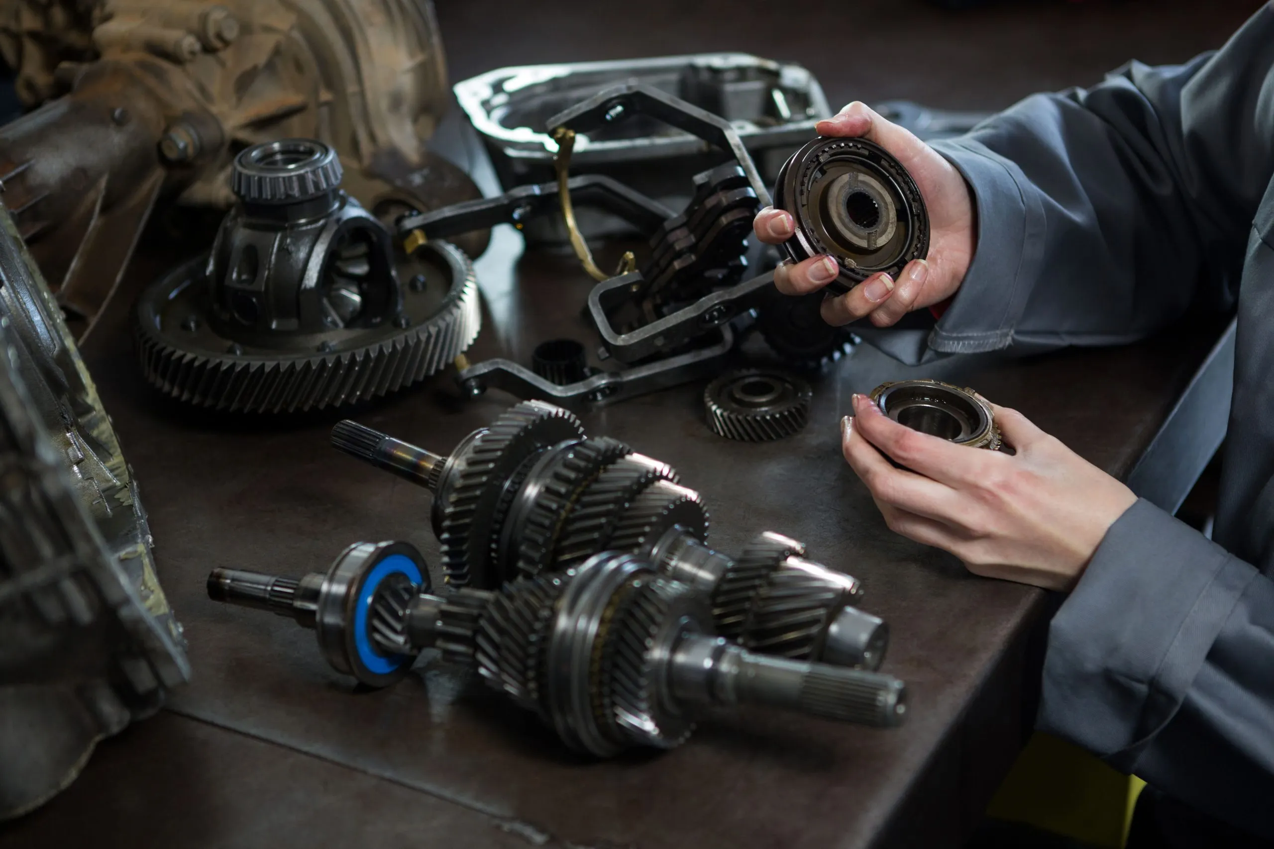 USA Automotive Aftermarket Parts Market Outlook 2030 female-mechanic-holding-spare-parts-car-1-scaled