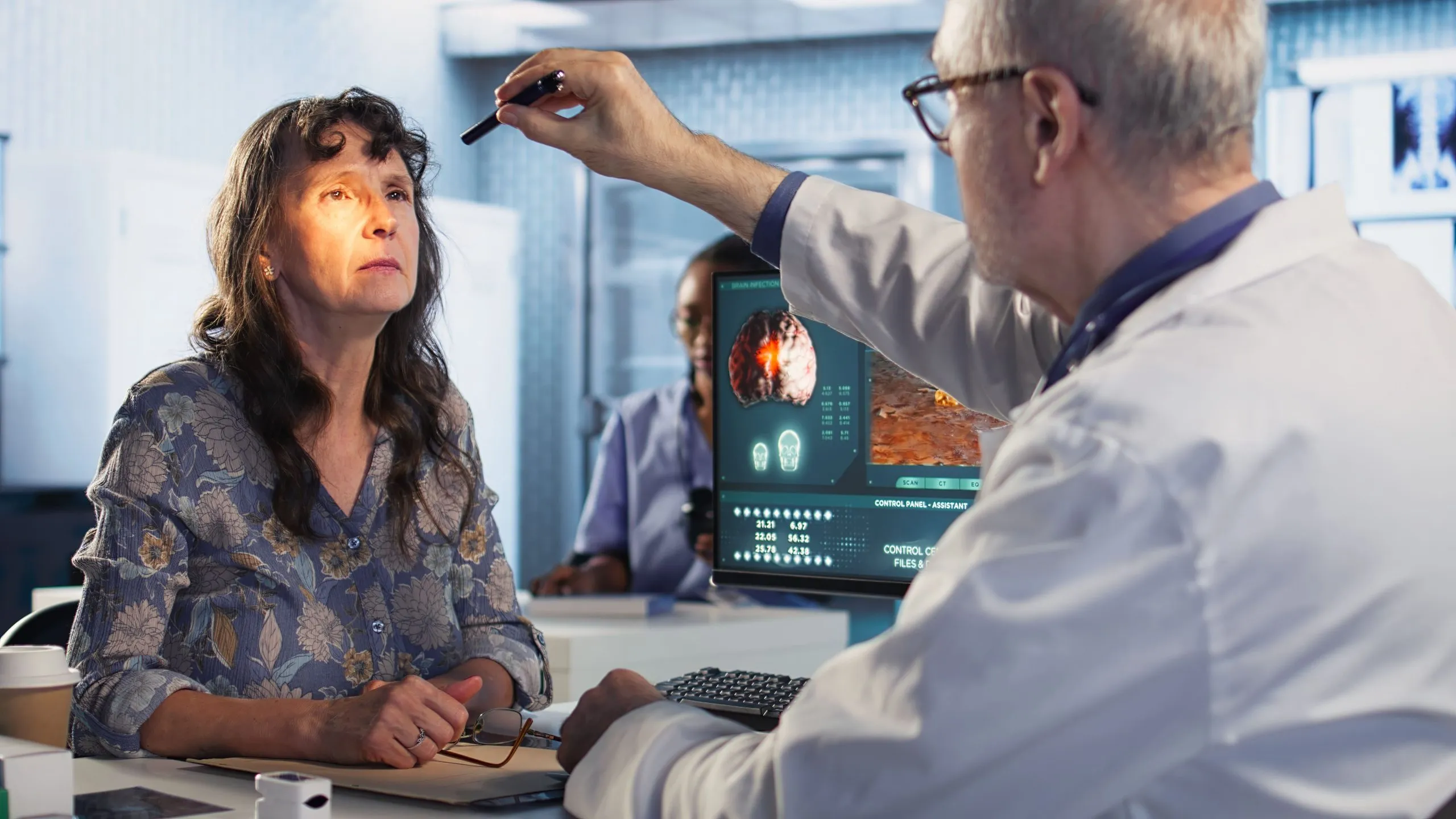 USA Stress Testing Market Outlook 2030 healthcare-expert-man-conducting-concussion-test-with-pen-light-cabinet-evaluating-woman-1-scaled