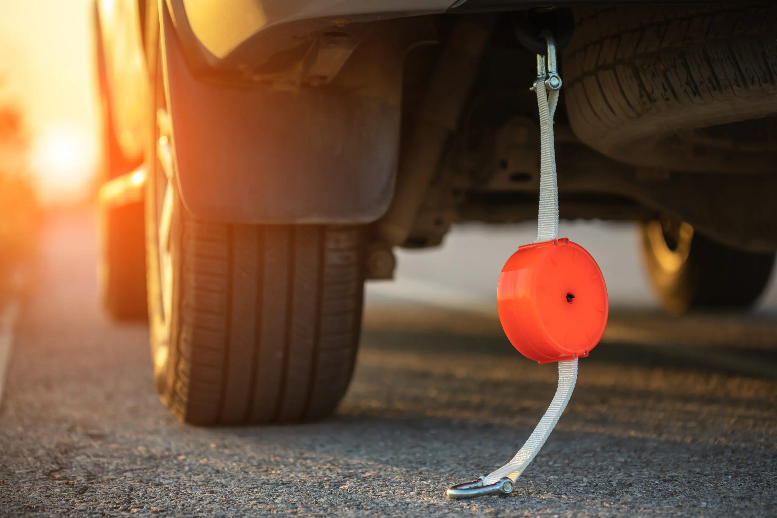 USA Emergency Braking Systems Market Outlook 2030 man-holding-emergency-car-towing-line-standing-infront-car-roadside-car-accident-repair-maintenance-concept-scaled