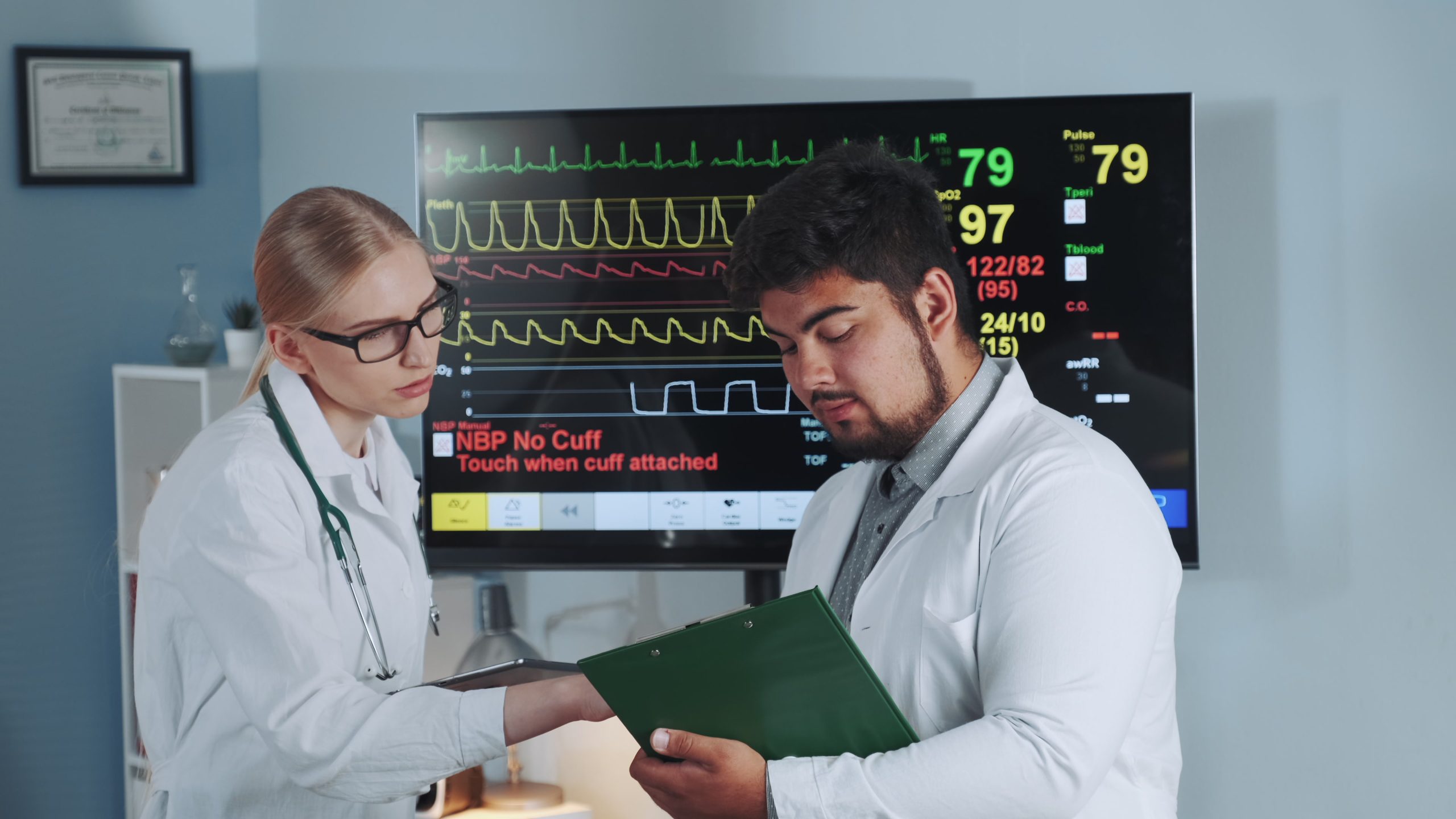 KSA Cardiac Biomarkers Market Outlook 2030 middle-close-up-diverse-sports-scientists-speaking-about-results-athlete-stress-test-scaled