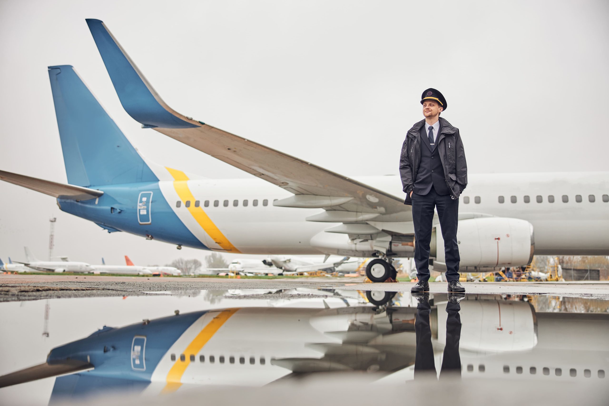 portrait-happy-confident-caucasian-airplane-crew-near-plane-1-scaled