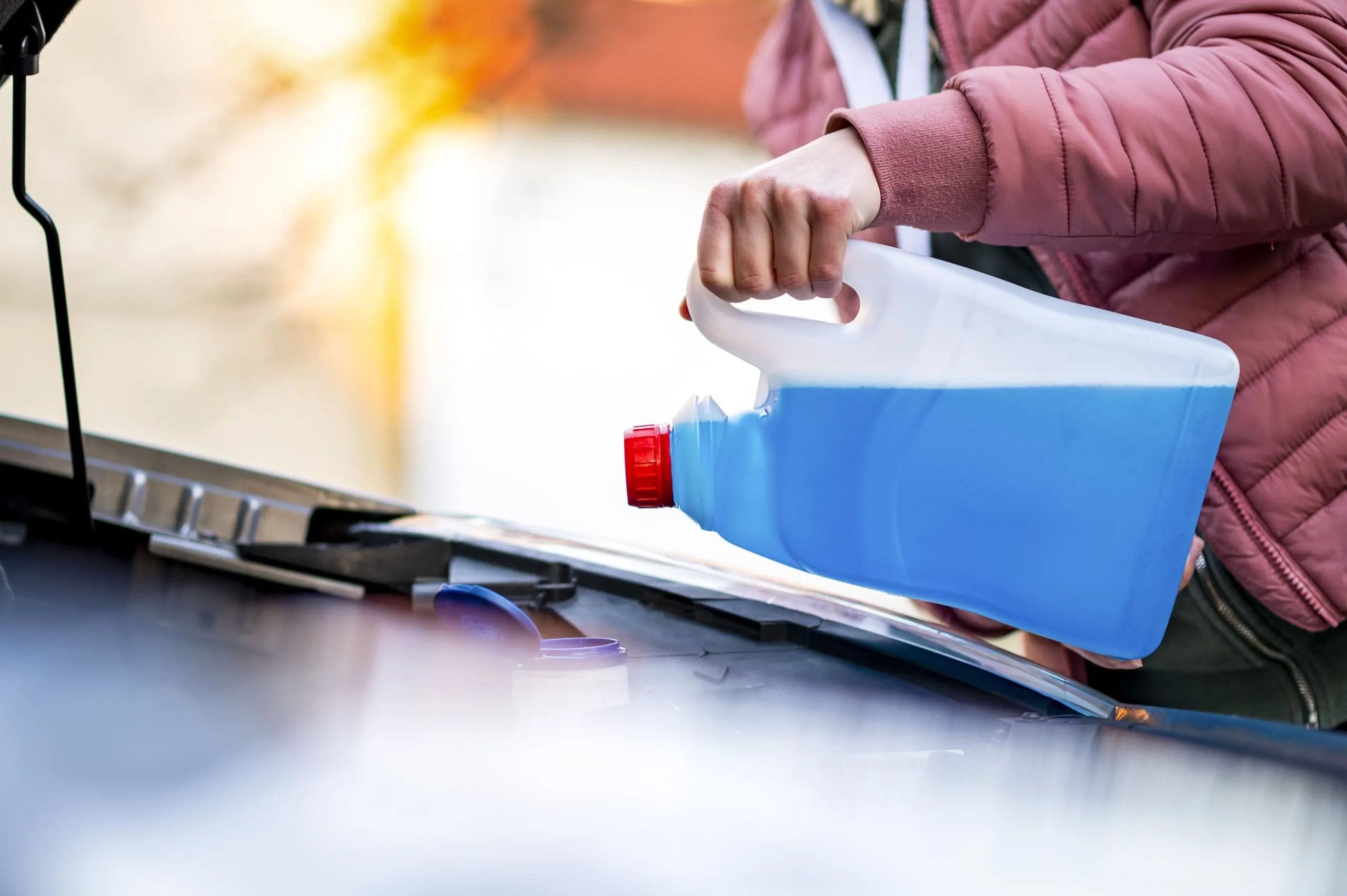 Philippines Windshield Washer Fluids Market Outlook 2030 pouring-antifreeze-filling-windshield-washer-tank-with-antifreeze-winter-cold-weather-1-scaled