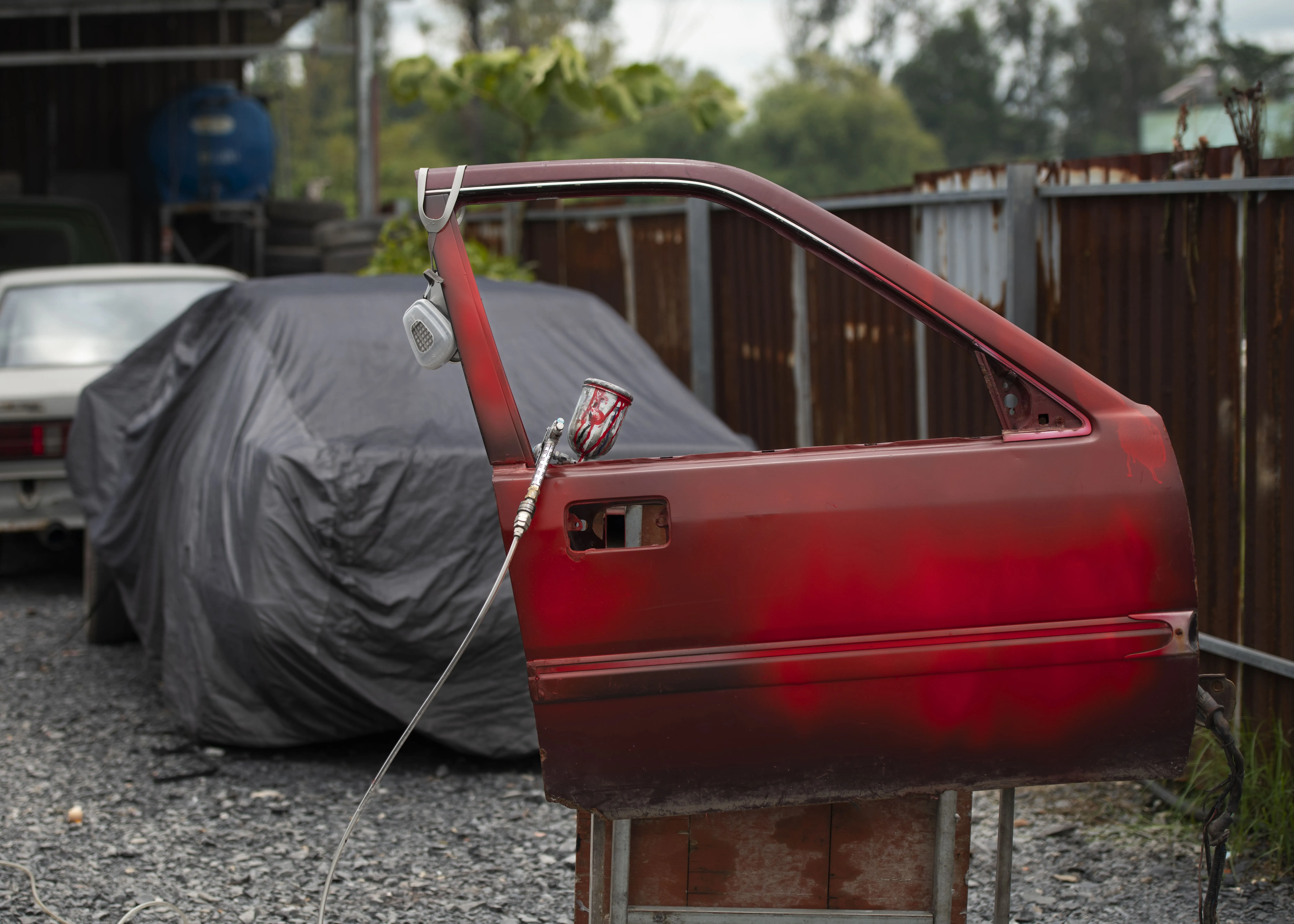 Philippines Crash Boxes Market Outlook 2030 spraying-powder-paint-concept-with-red-door-2