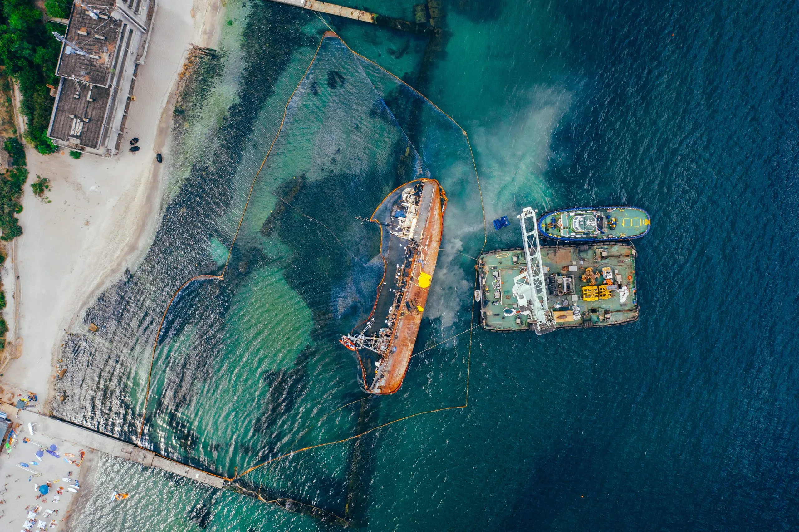 Australia Naval Vessel Defense Systems Market Outlook 2035 top-view-old-tanker-that-ran-aground-overturned-shore-near-coast-1-scaled