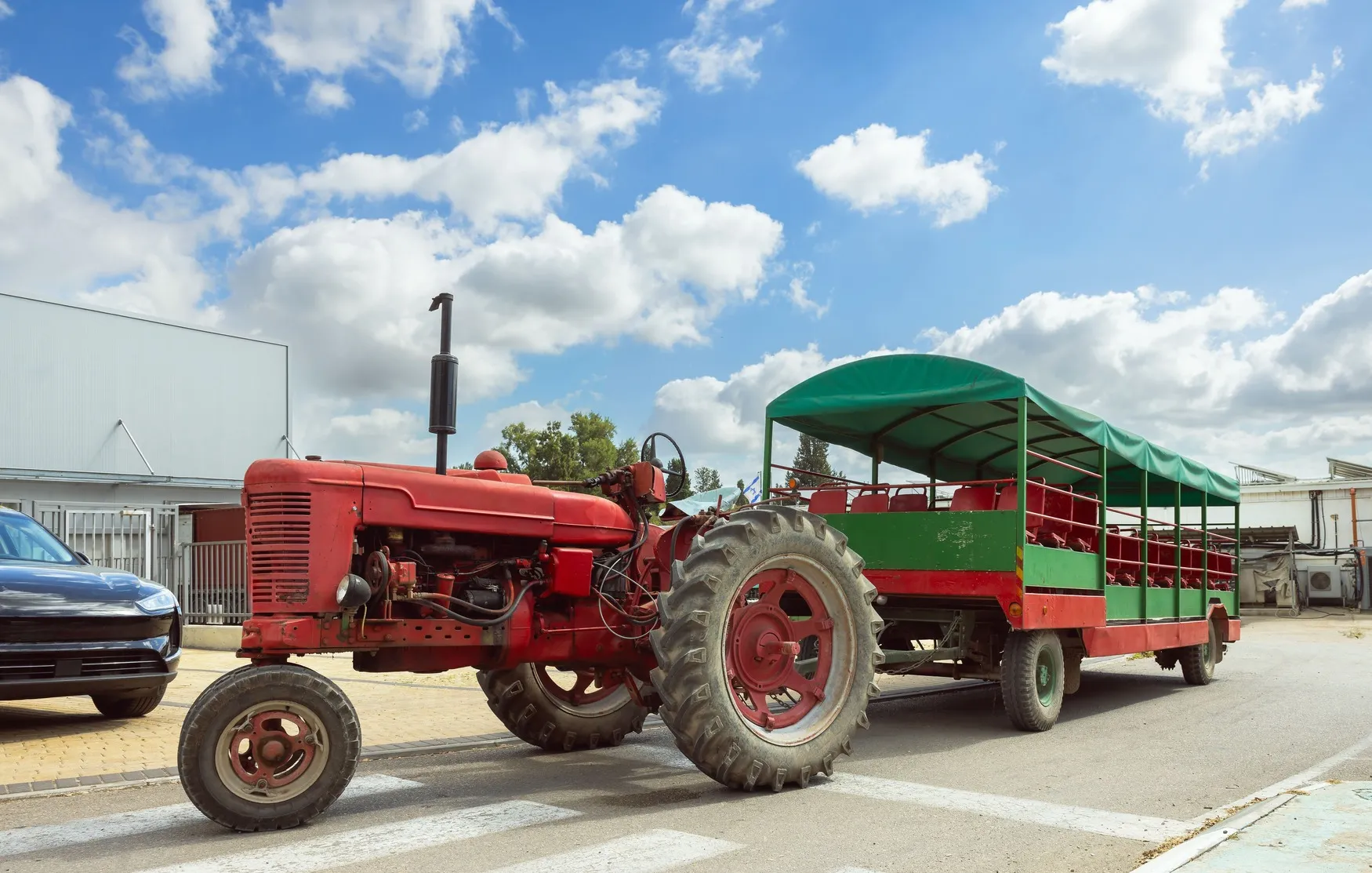 KSA Used Tractor Market Outlook to 2035 tractor-with-trolley-transporting-people-through-countryside-1