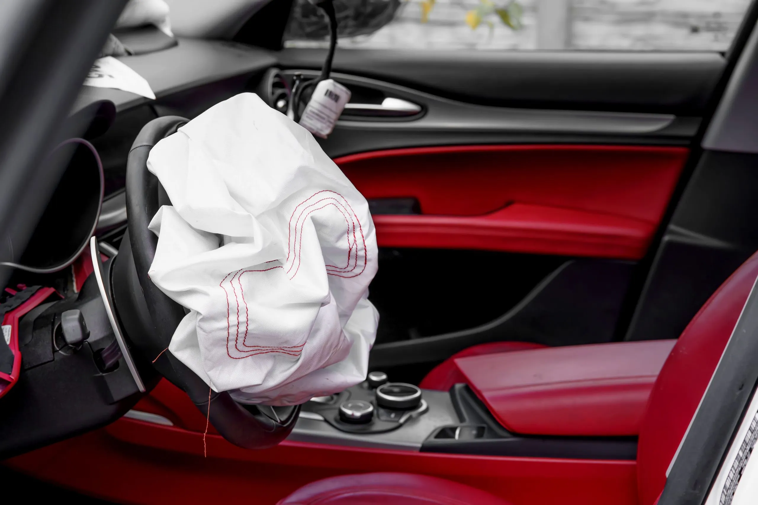 USA Airbags Market Outlook 2030 triggered-airbag-steering-wheel-closeup-1-scaled
