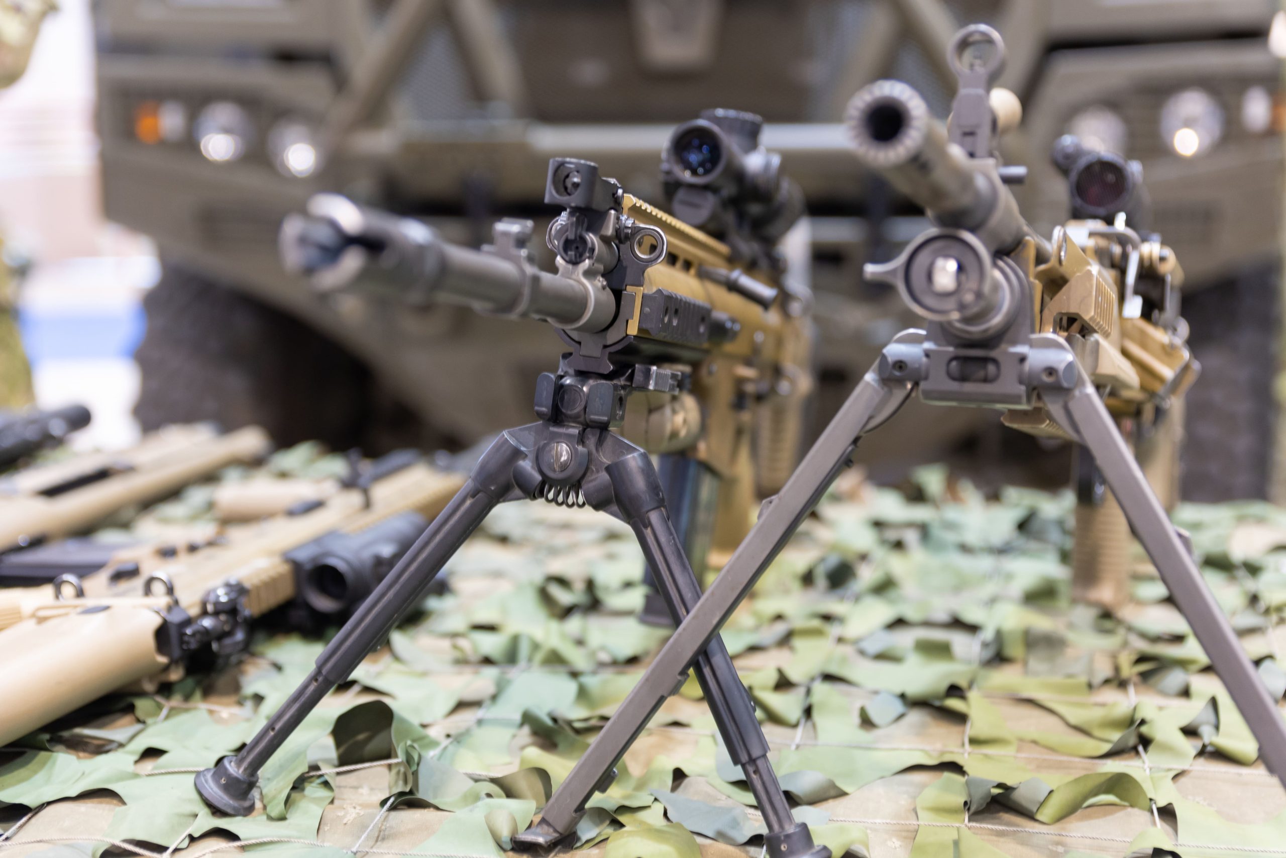 tripodmounted-camouflaged-weapon-army-riffles-1-scaled