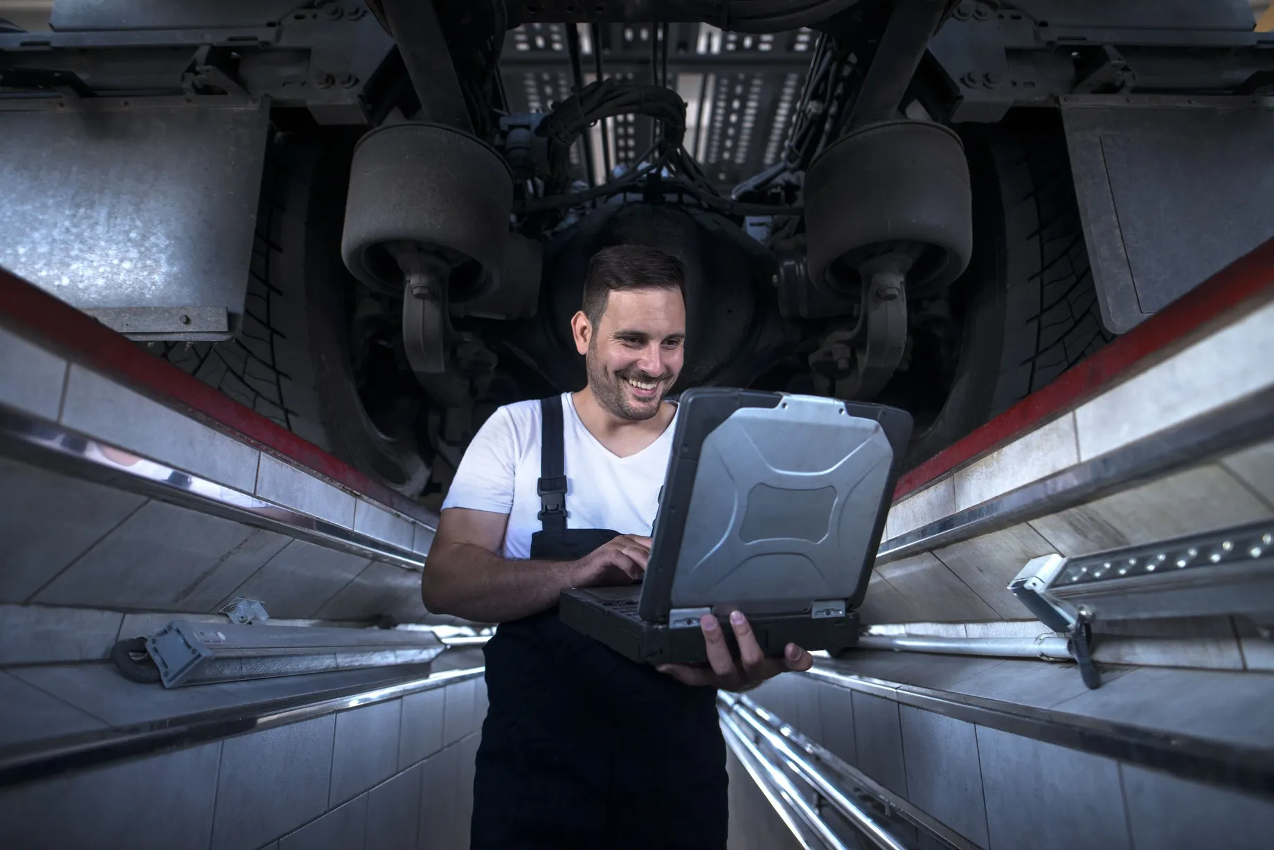 USA Commercial Aircraft Battery Management Market outlook to 2035 vehicle-mechanic-with-diagnostic-tool-laptop-working-truck-workshop-2