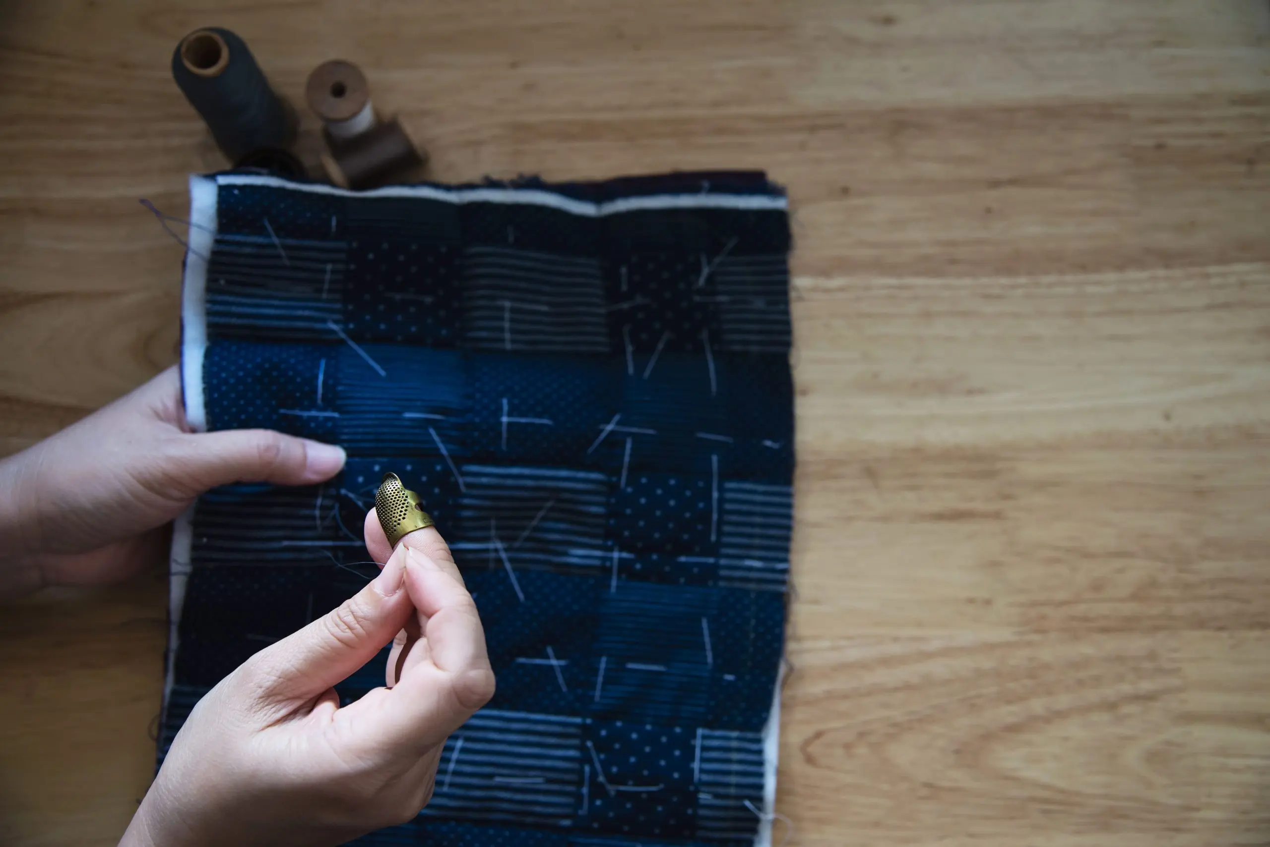 KSA Smart Textiles for Military Market outlook to 2035 vintage-woman-sewing-cloth-by-hand-with-embroidery-set-wooden-table-people-handmade-diy-housework-concept-1-scaled