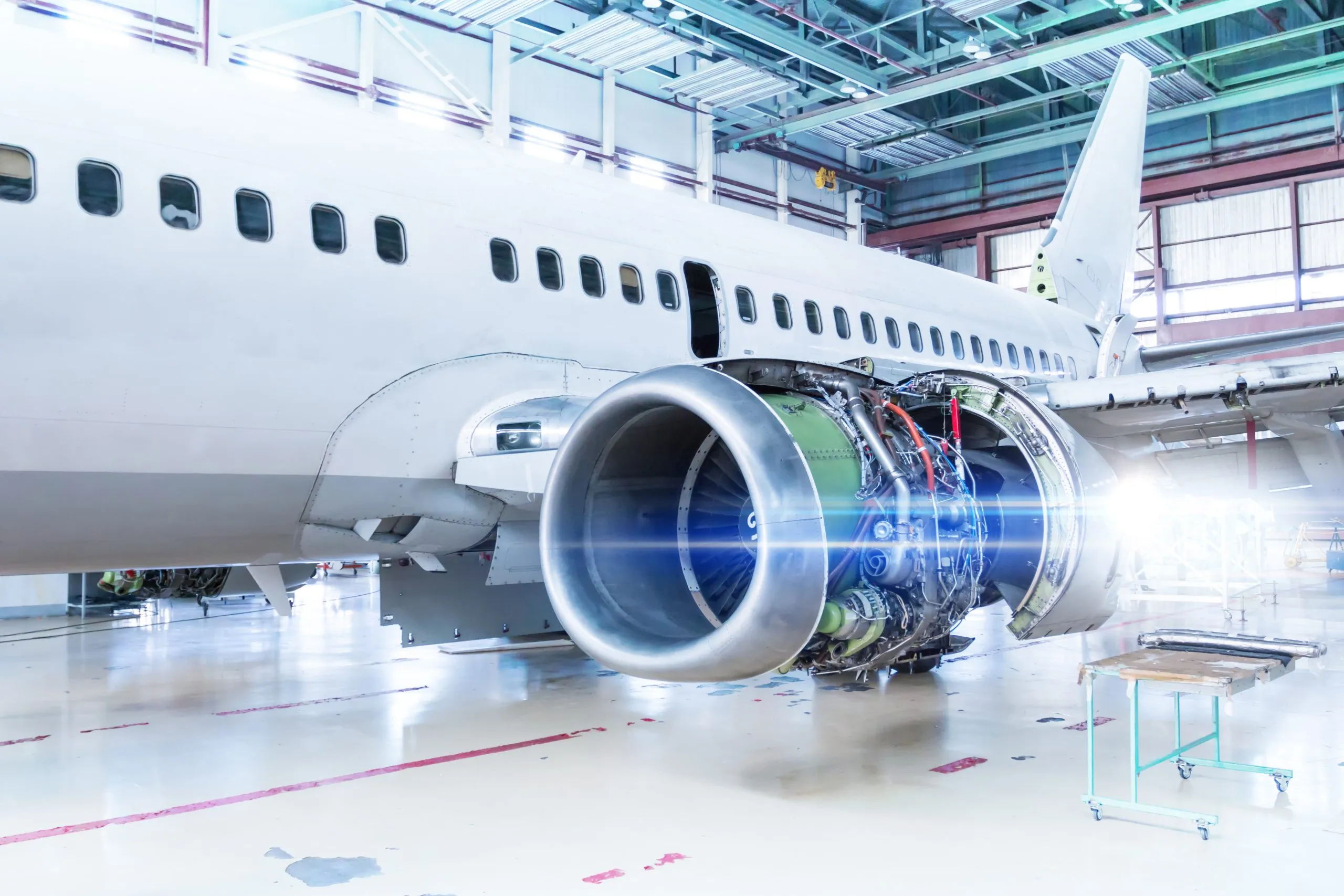 US aircraft MRO Market outlook 2035 white-passenger-airplane-maintenance-hangar-repair-aircraft-engine-wing-checking-mechanical-systems-flight-operations-scaled
