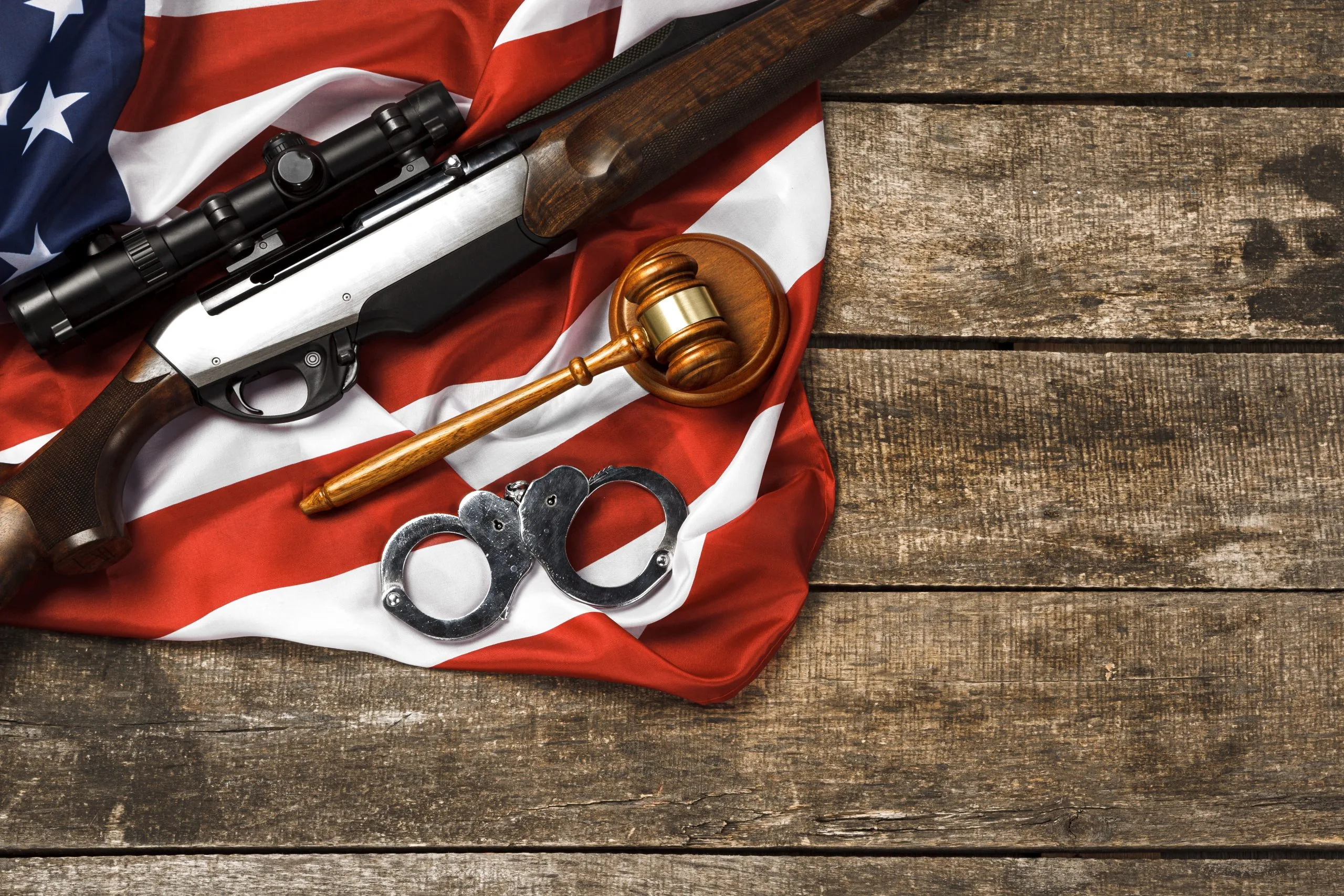 US light weapons Market outlook 2035 wooden-judge-gavel-hunting-rifle-usa-flag-wooden-background-scaled