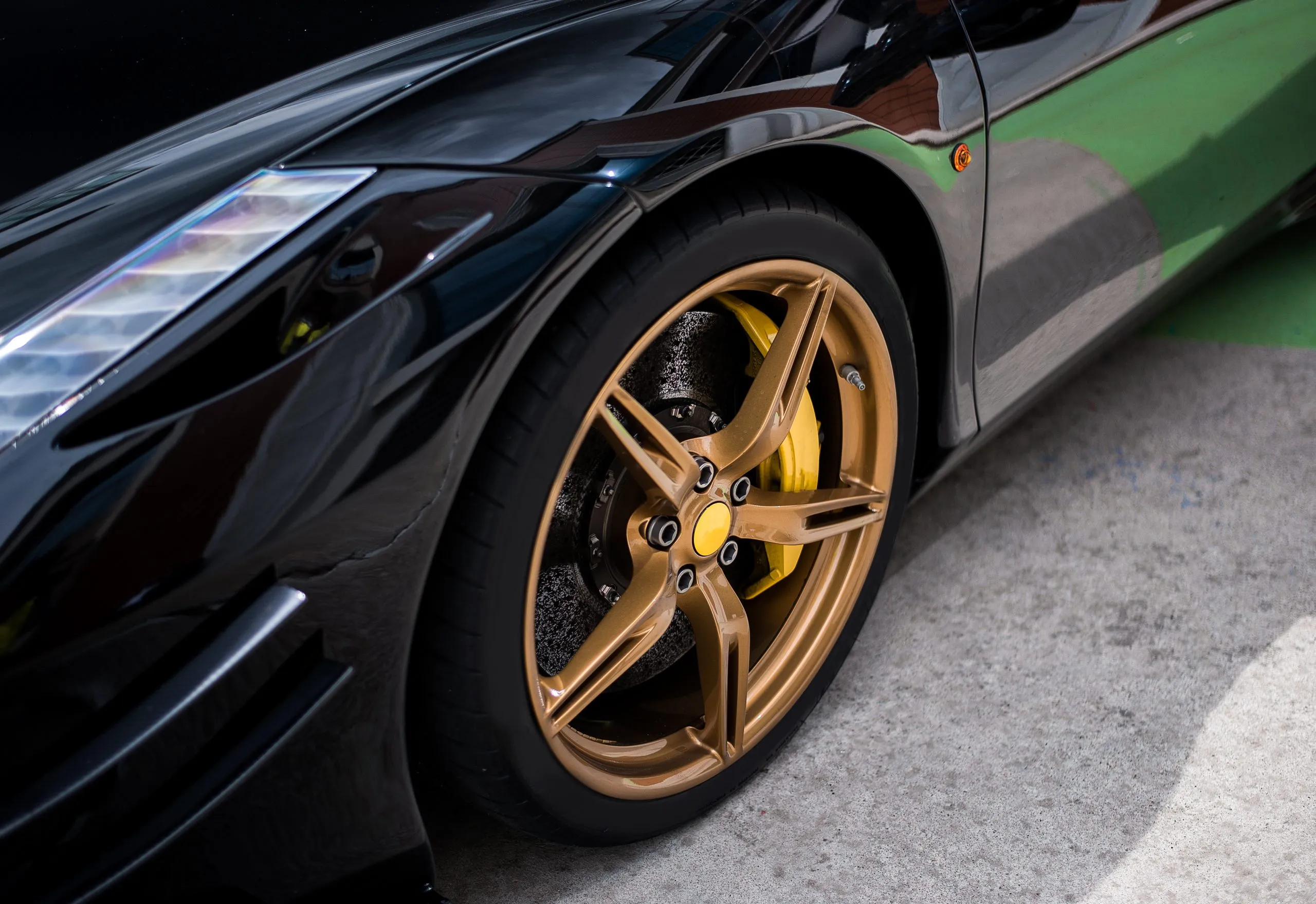 Philippines Alloy Wheels Market Outlook to 2035 black-sedan-car-wheel-with-golden-bronze-color-decoration-scaled