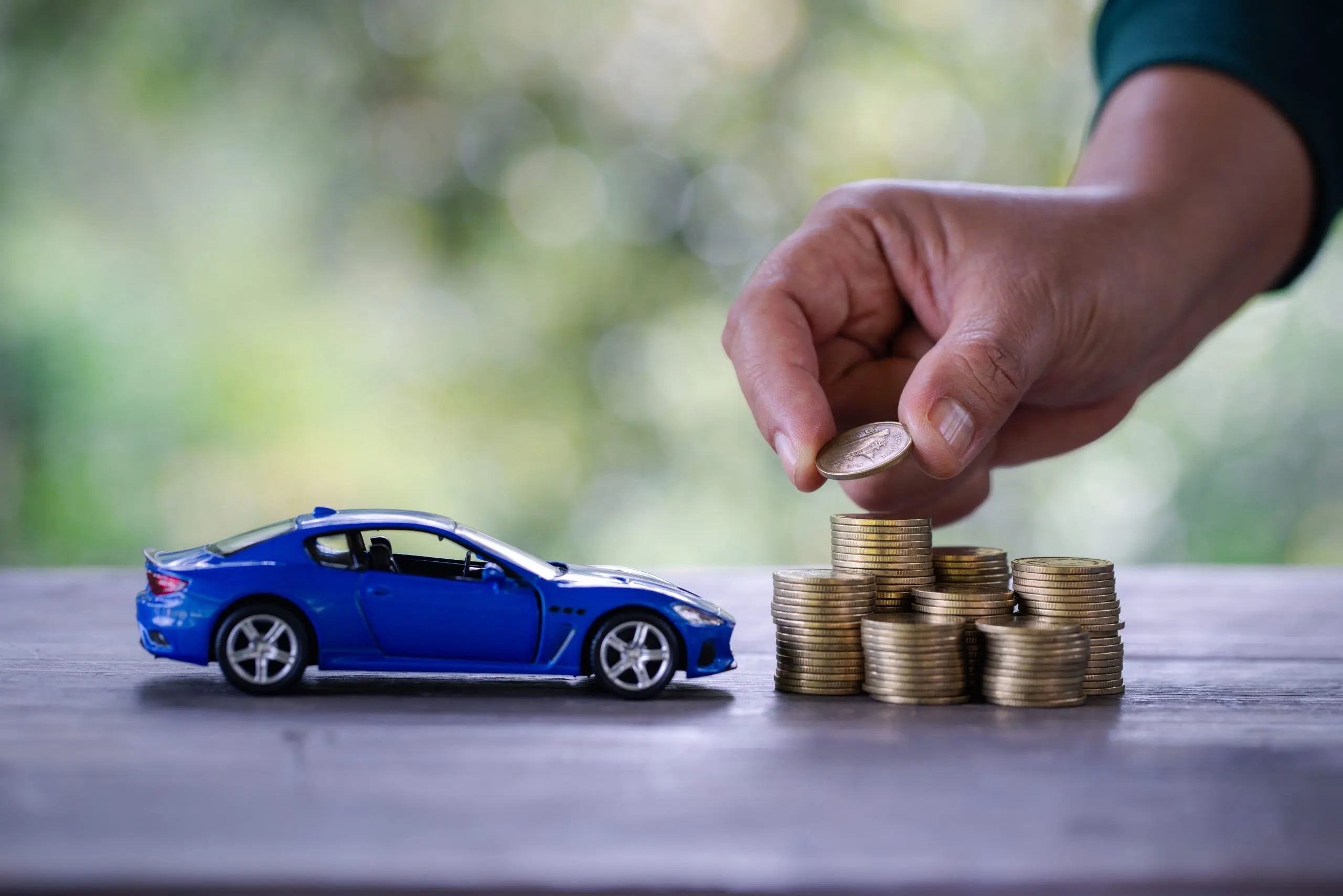KSA car finance Market Outlook to 2035 business-woman-close-up-hand-holding-coin-lot-money-stacked-coins-insurance-loan-buying-car-finance-concept-buy-installments-down-payment-car-scaled