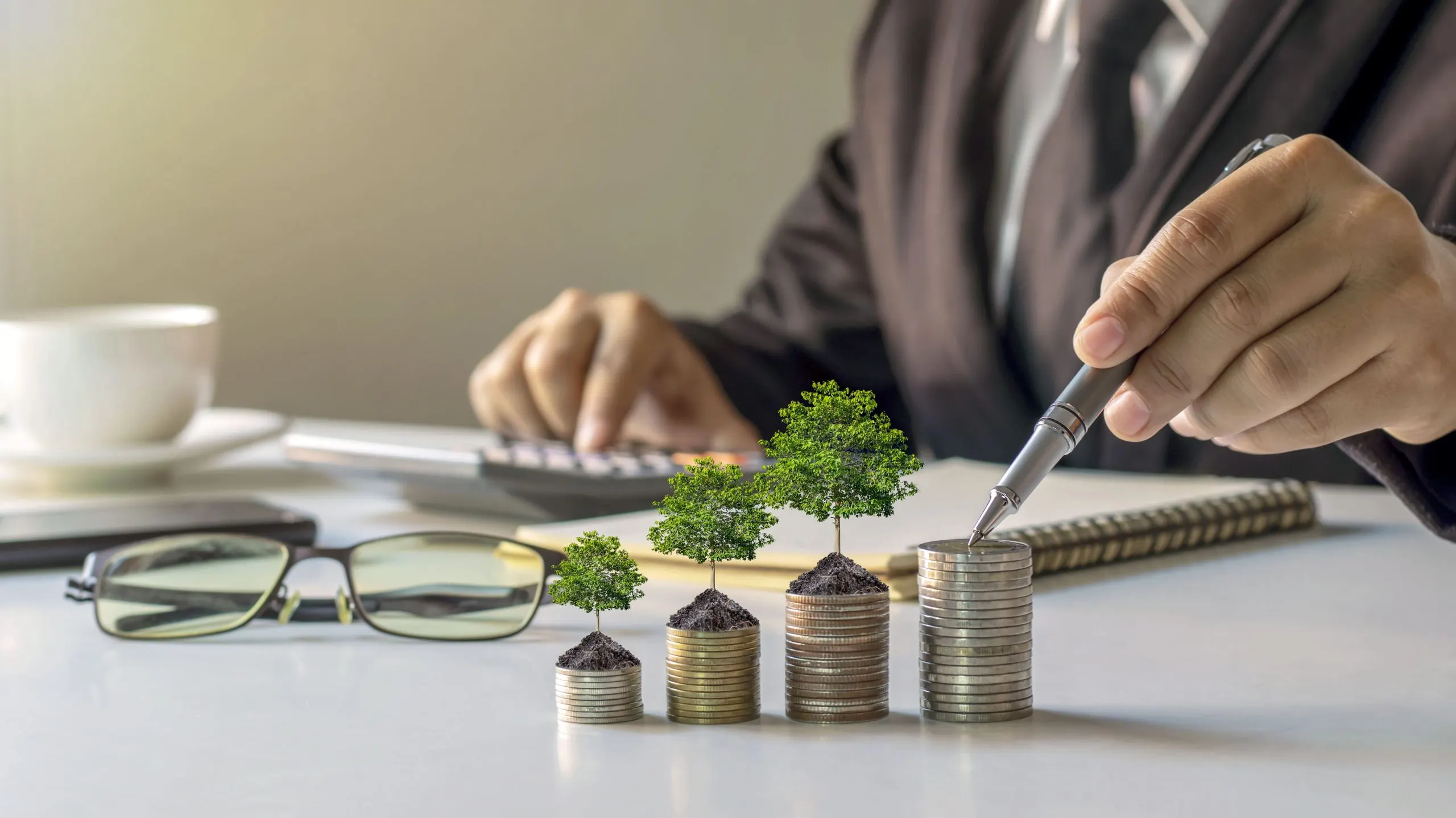Qatar Wealth Management Market Outlook to 2035 businessmen-plant-trees-piles-money-ideas-save-money-invest-future-1-scaled