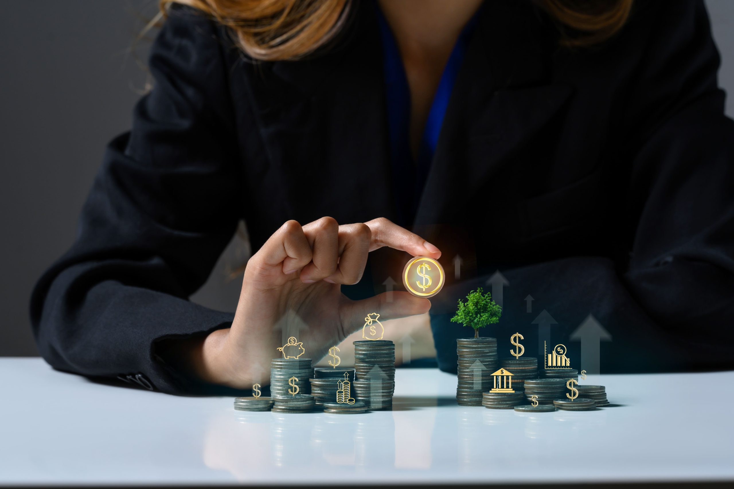 businesswoman-with-stack-coins-small-tree-growing-coin-saving-money-investment-concepts-1-scaled
