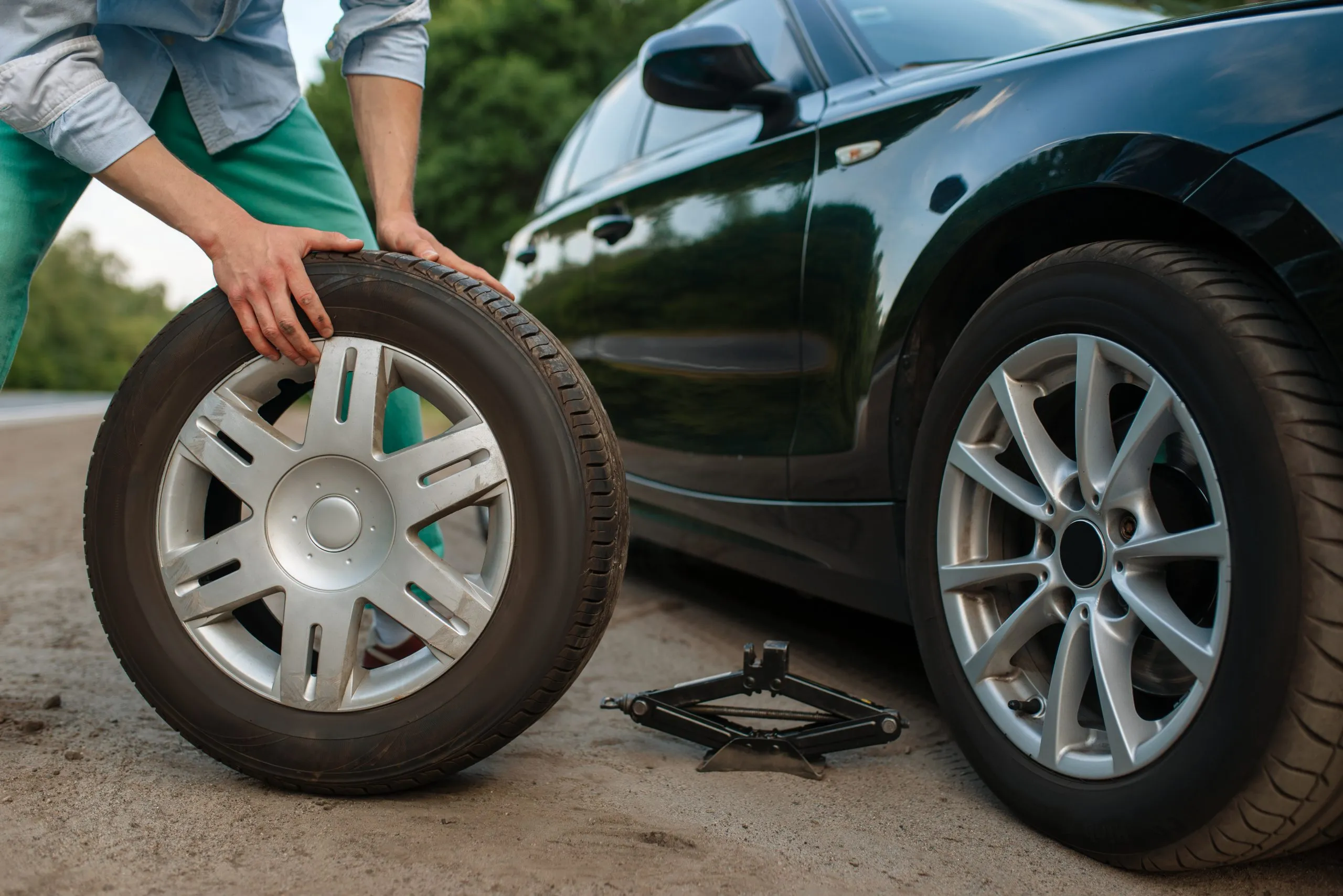 Philippines Retreaded Tires Market Outlook to 2035 car-breakdown-man-puts-spare-tire-1-scaled