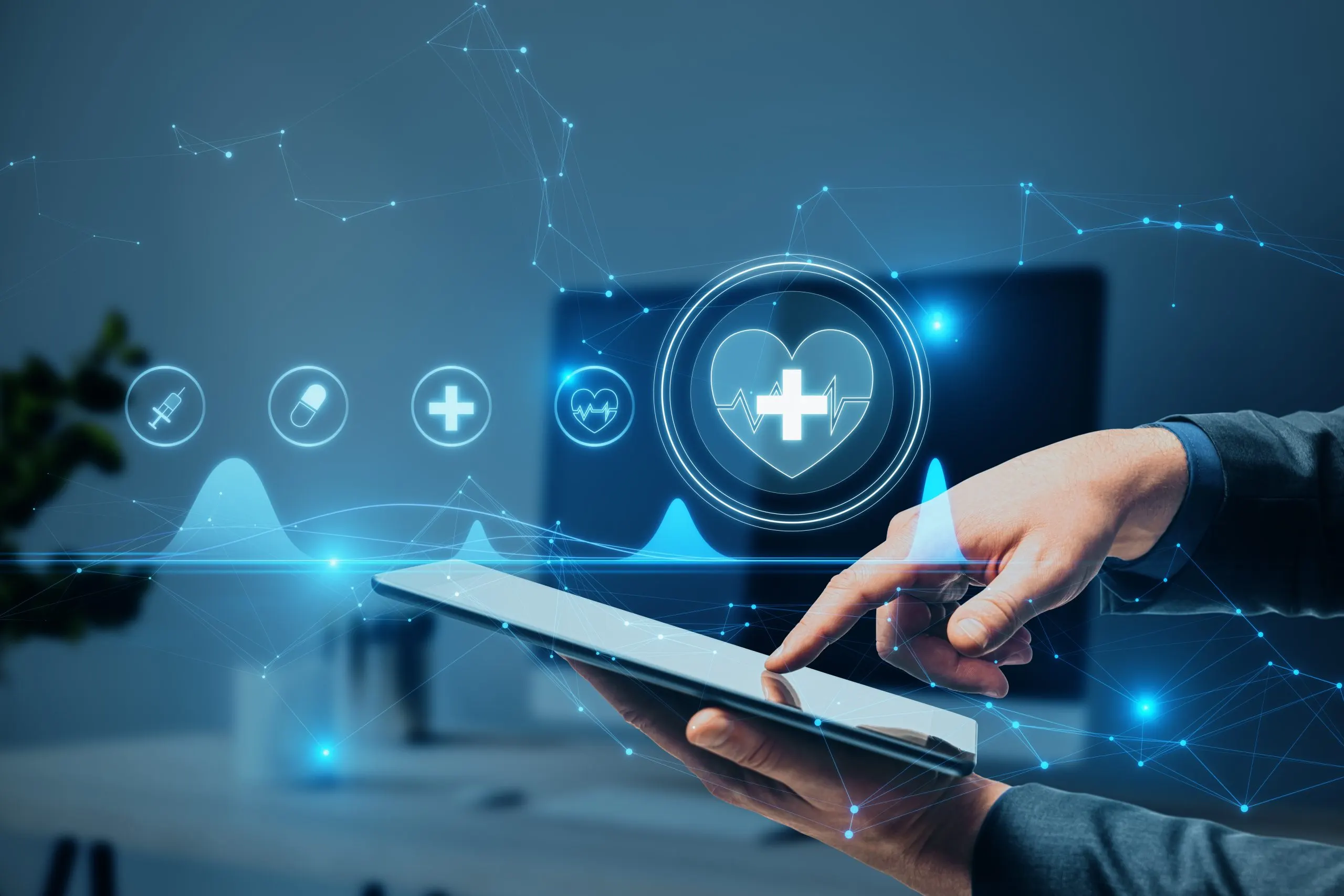 Malaysia Digital Health Market Outlook to 2035 close-up-businessman-hand-pointing-tablet-with-creative-polygonal-medical-interface-hologram-blurry-hospital-office-interior-background-online-healthcare-cardiology-technology-concept-scaled