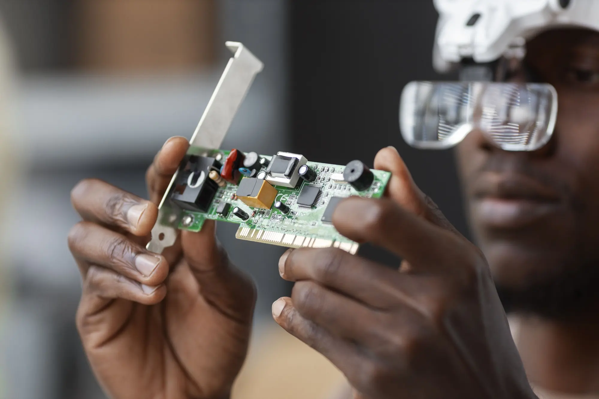 Nigeria Semiconductor Infrastructure Market Outlook to 2035 close-up-man-repairing-computer-chips-1