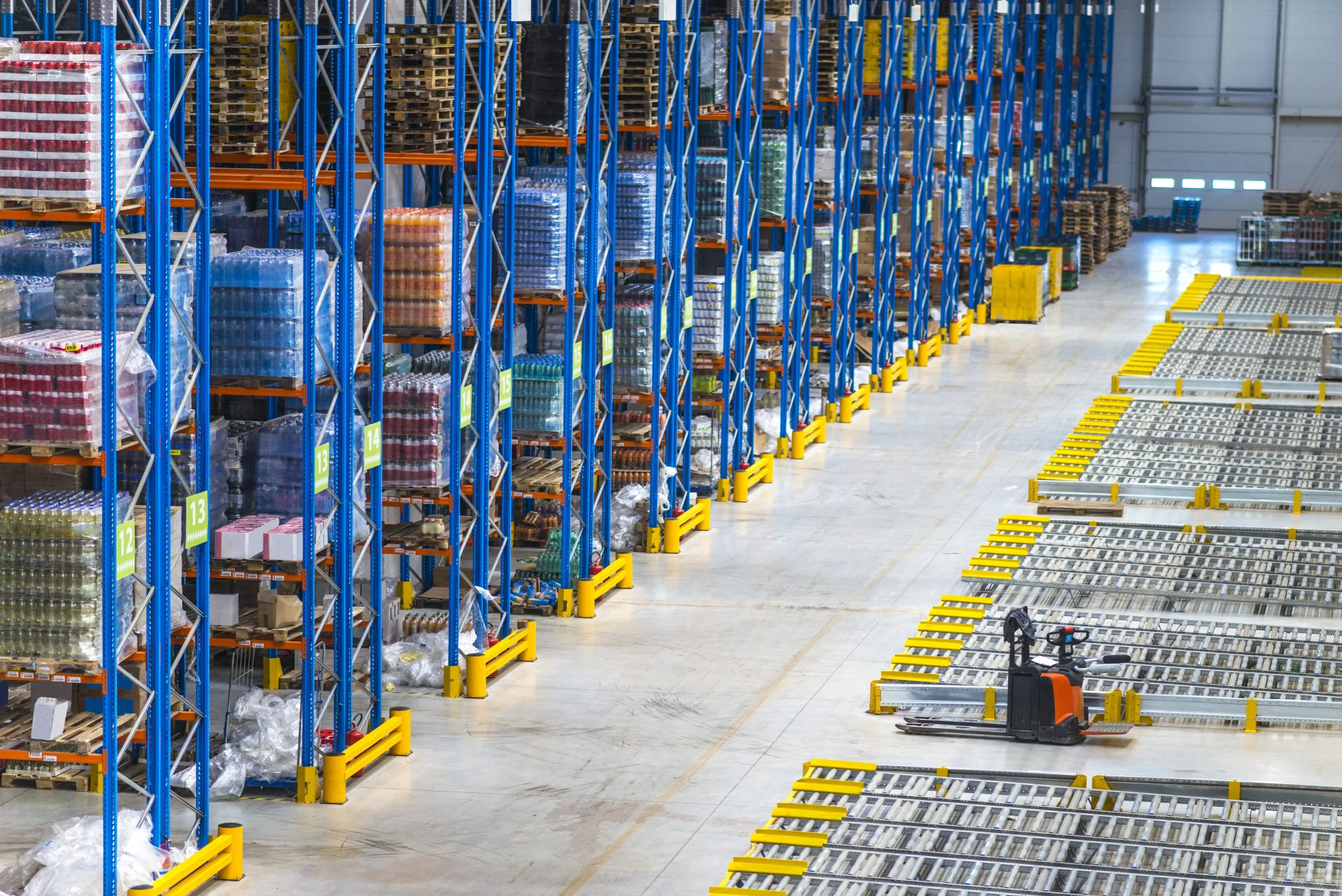 distribution-warehouse-building-interior-large-storage-area-with-goods-shelf-1-scaled