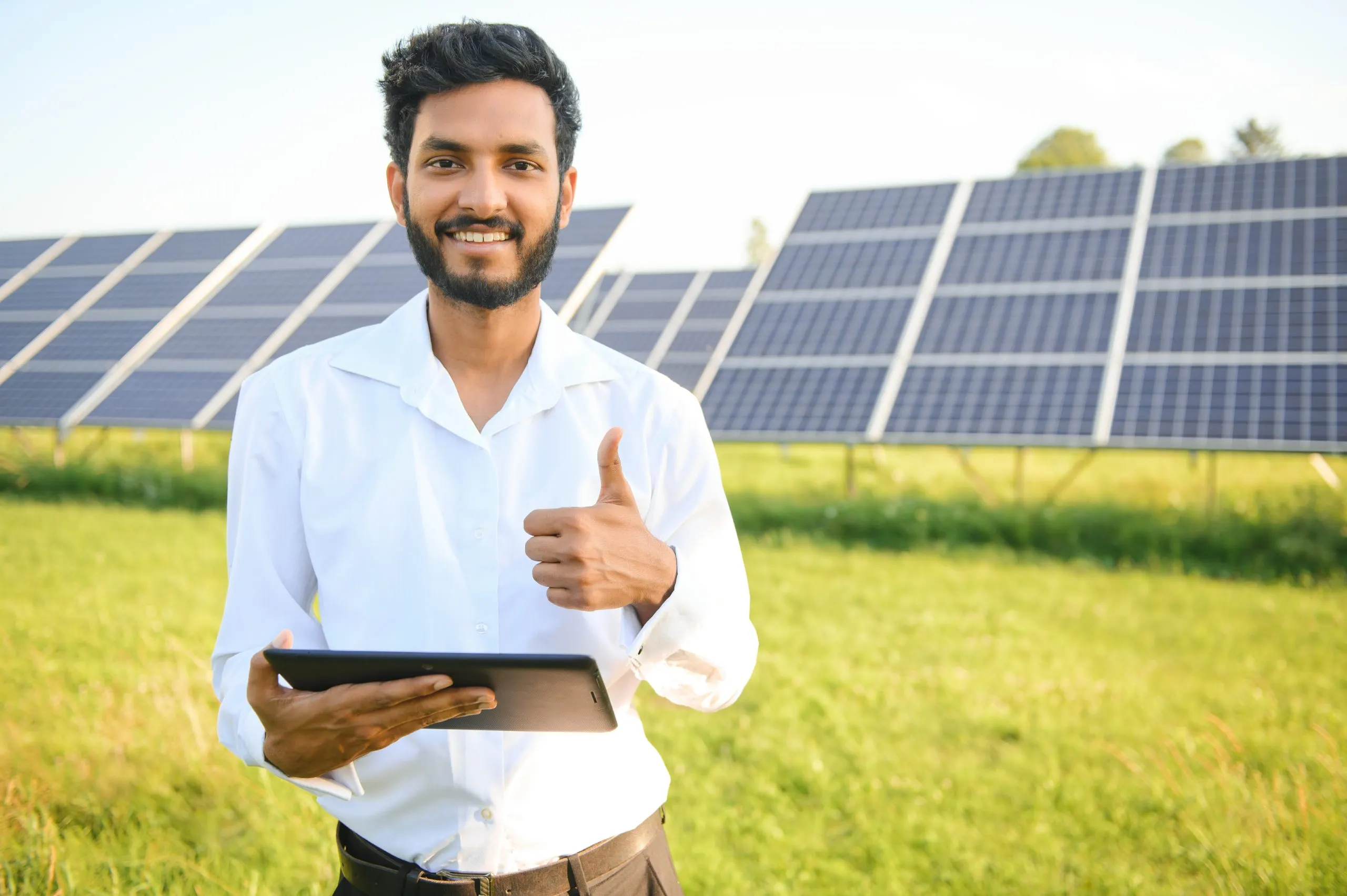 South Africa Solar EPC Market Outlook to 2035 portrait-young-indian-male-engineer-standing-near-solar-panels-with-clear-blue-sky-background-renewable-clean-energy-skill-india-copy-space-scaled