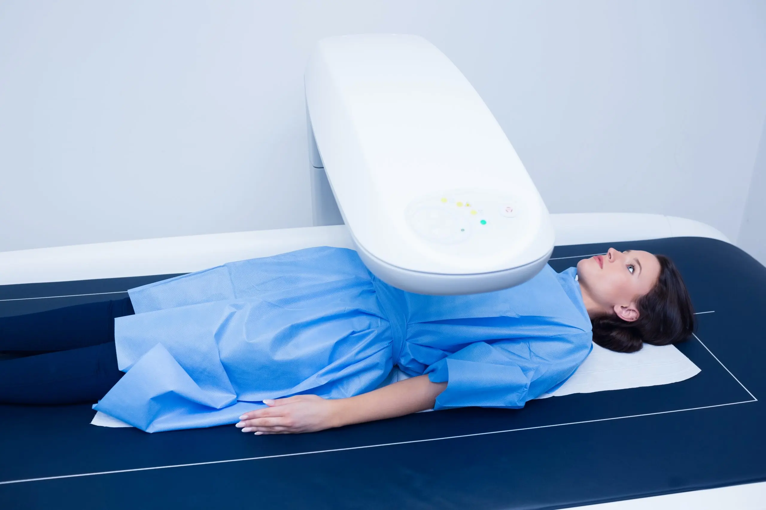 UAE Breast MRI Equipment Market Outlook 2035 sick-woman-lying-x-ray-machine-scaled