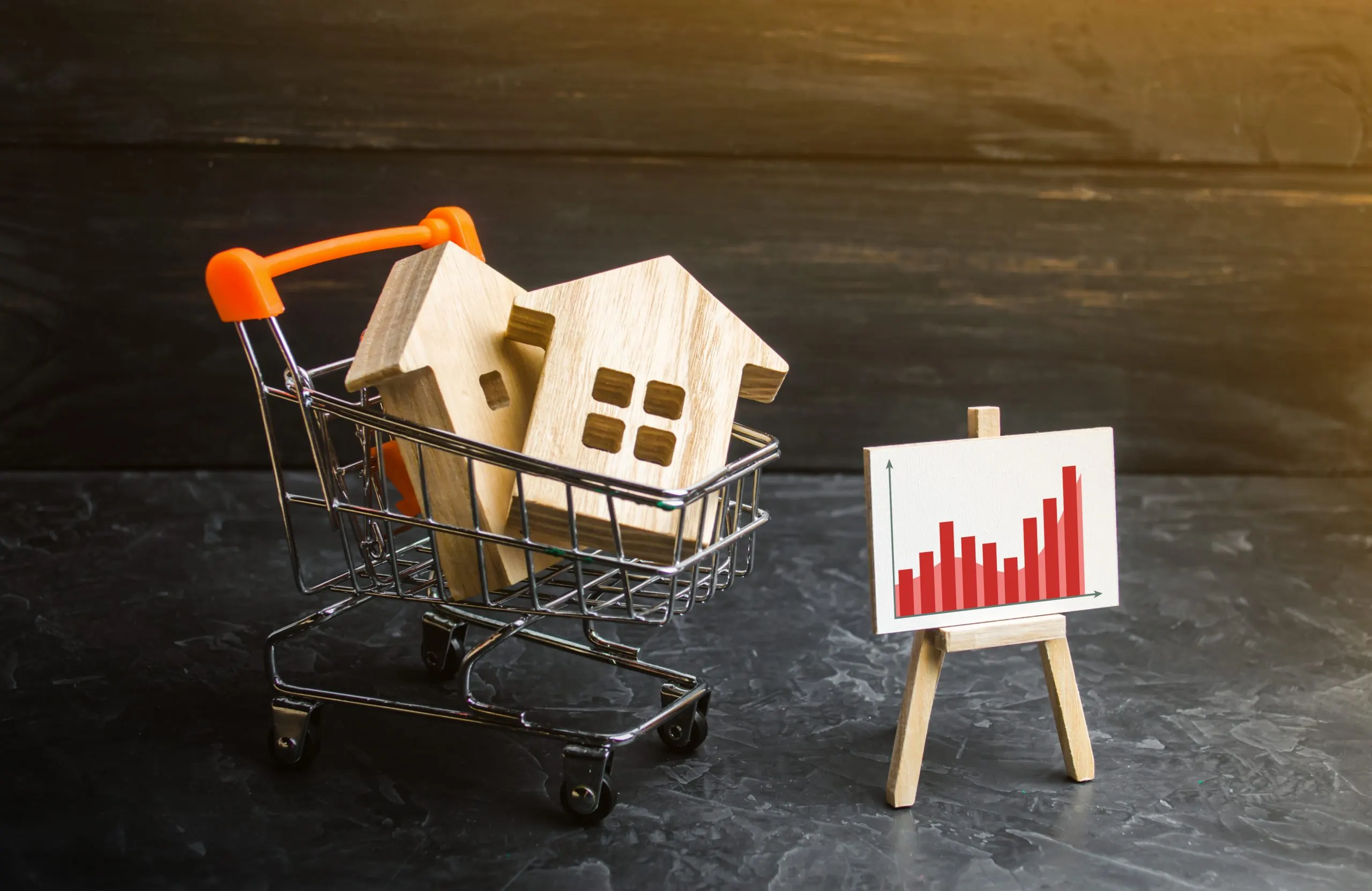 supermarket-trolley-with-houses-poster-with-graph-statistics-growing-demand-housing-scaled
