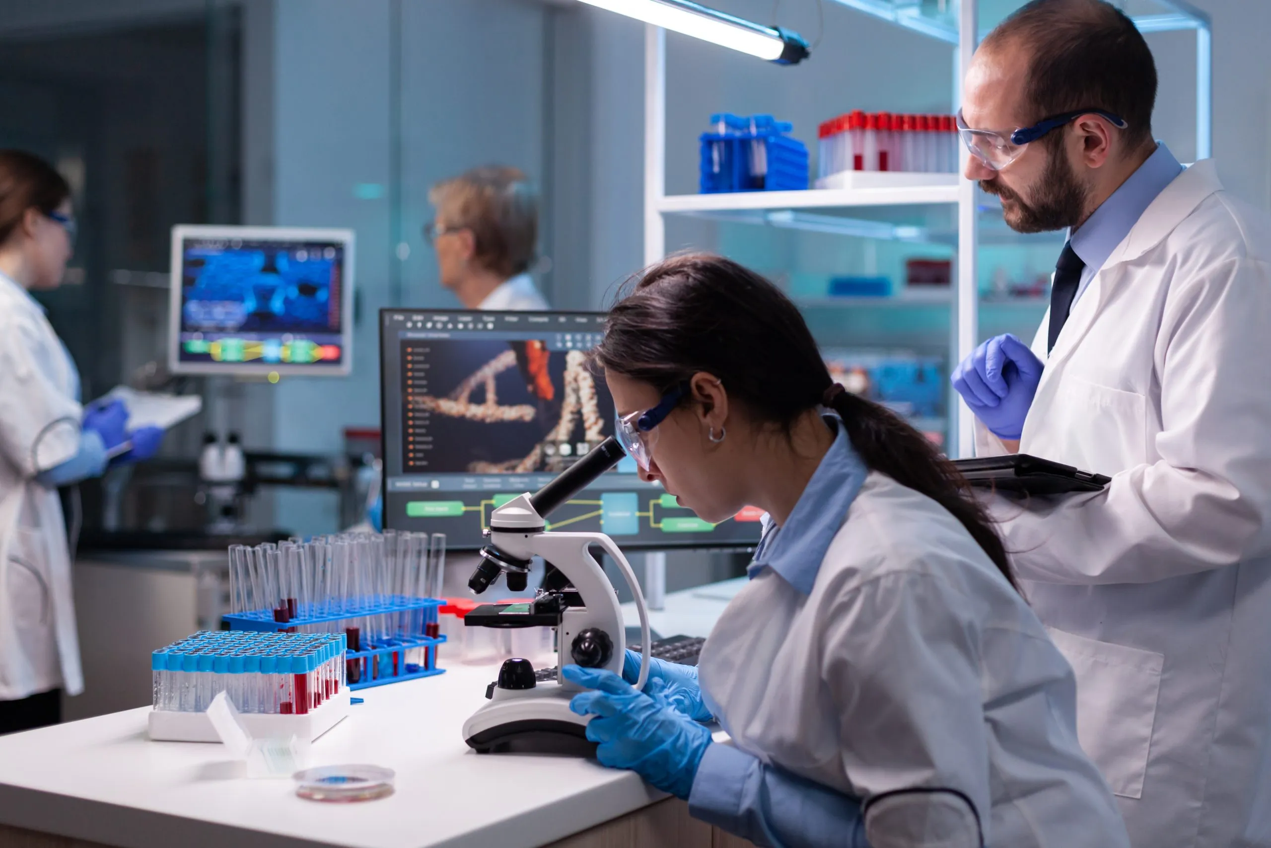 Singapore Diagnostic Labs Market Outlook to 2035 team-medical-research-scientists-analyzing-virus-disease-using-microscope-equipped-laboratory-scaled
