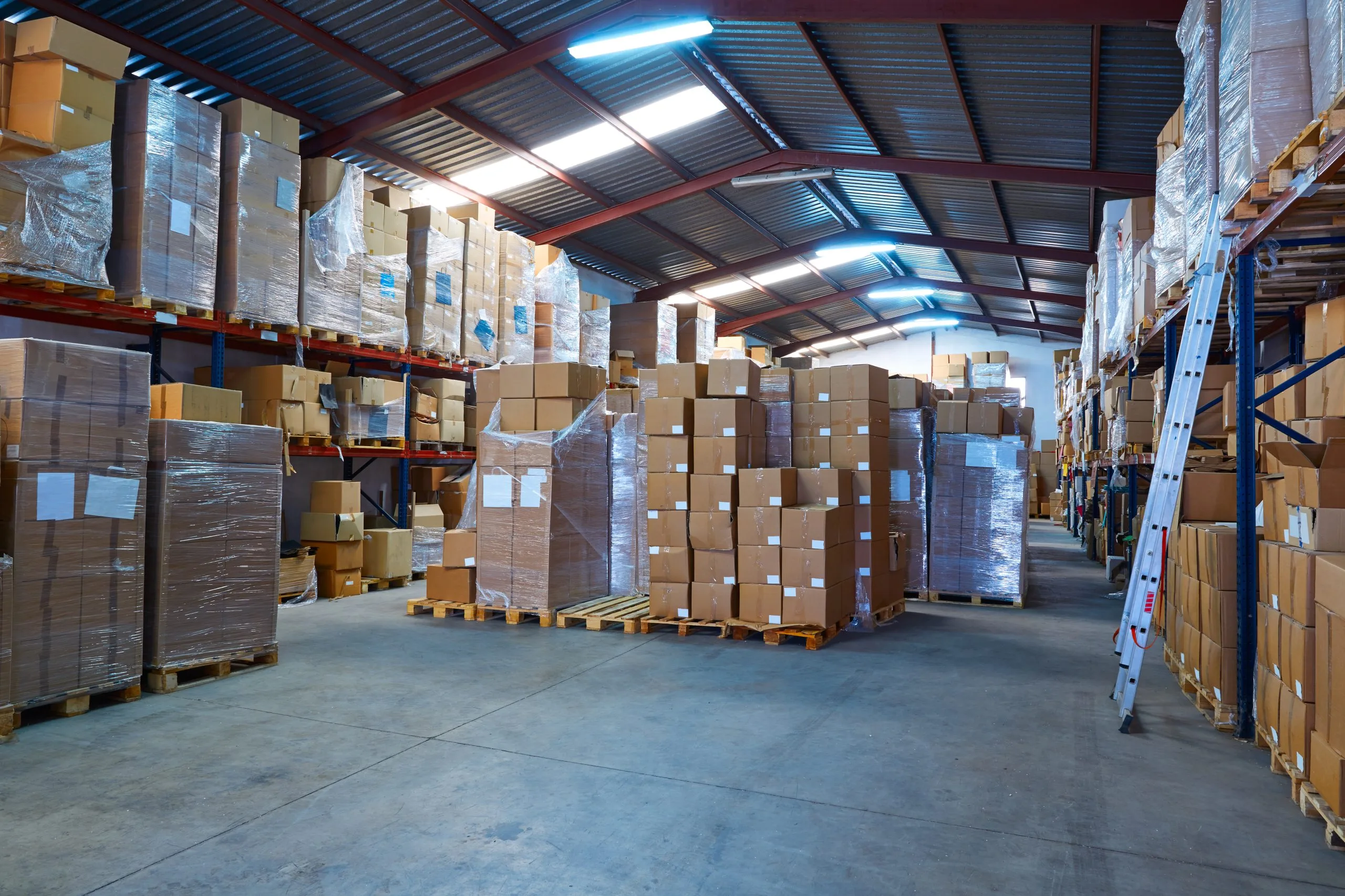 USA Warehousing Market Outlook to 2035 warehouse-stograge-with-stacked-boxes-rows-scaled