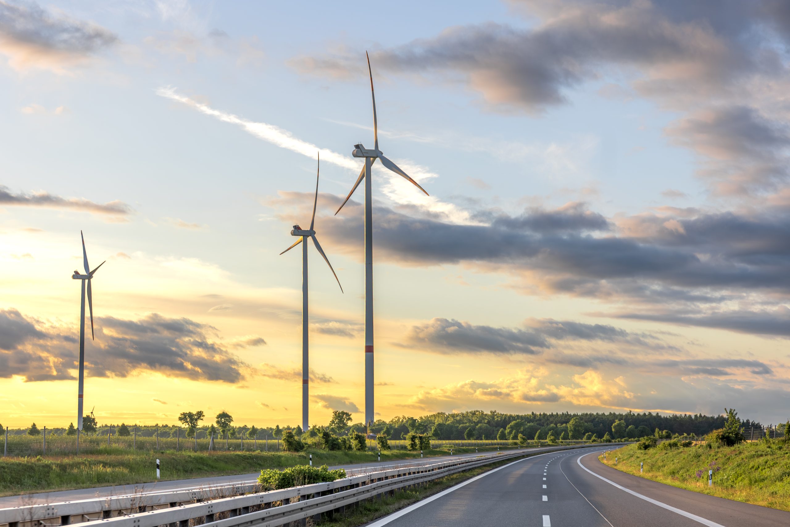 wind-turbines-sunset-road-clean-energy-scaled