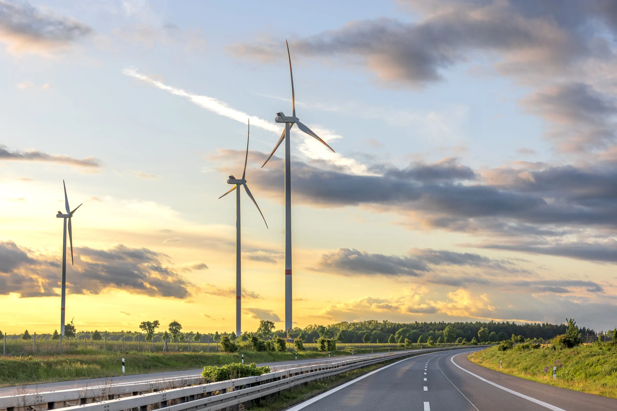 UK Wind Energy Market Outlook to 2035 wind-turbines-sunset-road-clean-energy-scaled