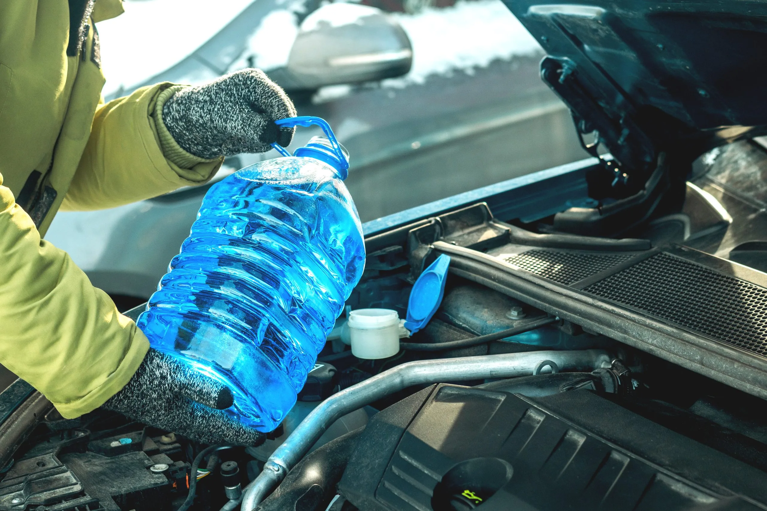 USA Coolants Market Outlook to 2035 winter-car-maintenance-person-refilling-windshield-washer-fluid-scaled