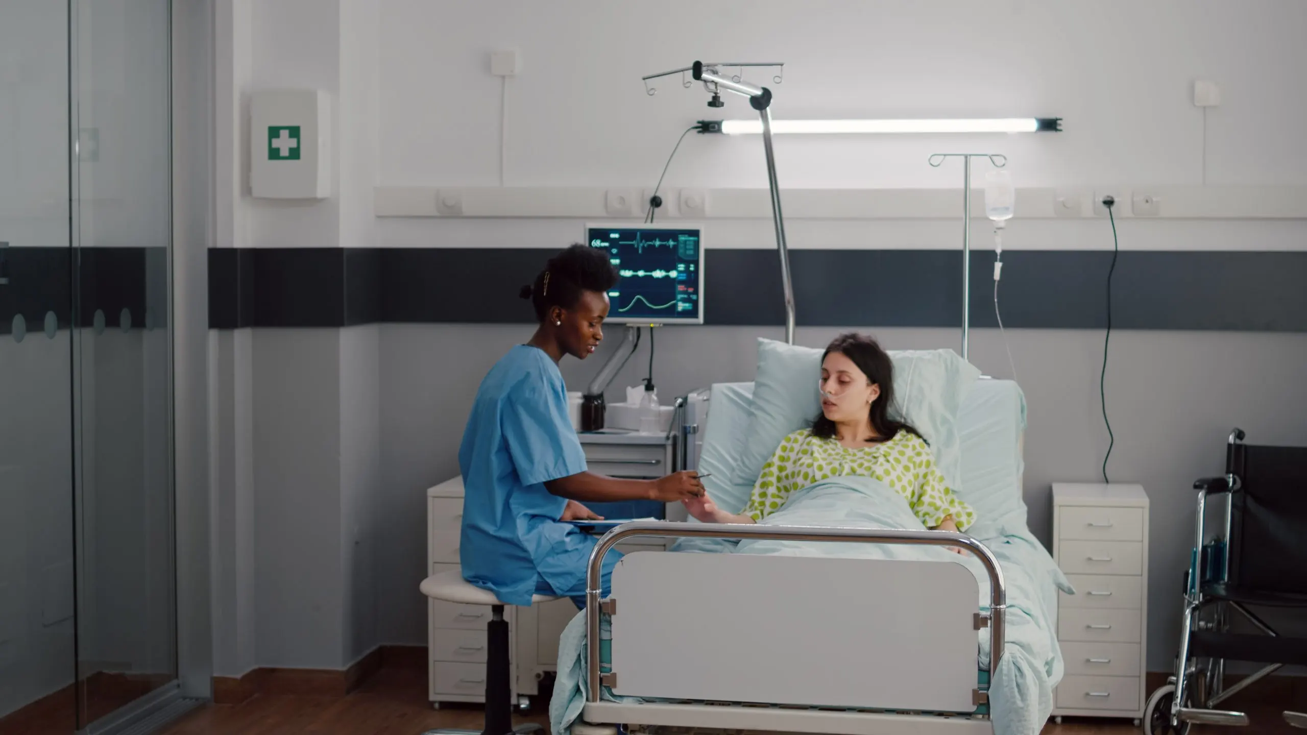 KSA ICU Beds Market Outlook 2035 afro-american-nurse-checkup-sick-woman-analyzing-pulse-using-medical-oximeter-working-hospital-ward-scaled