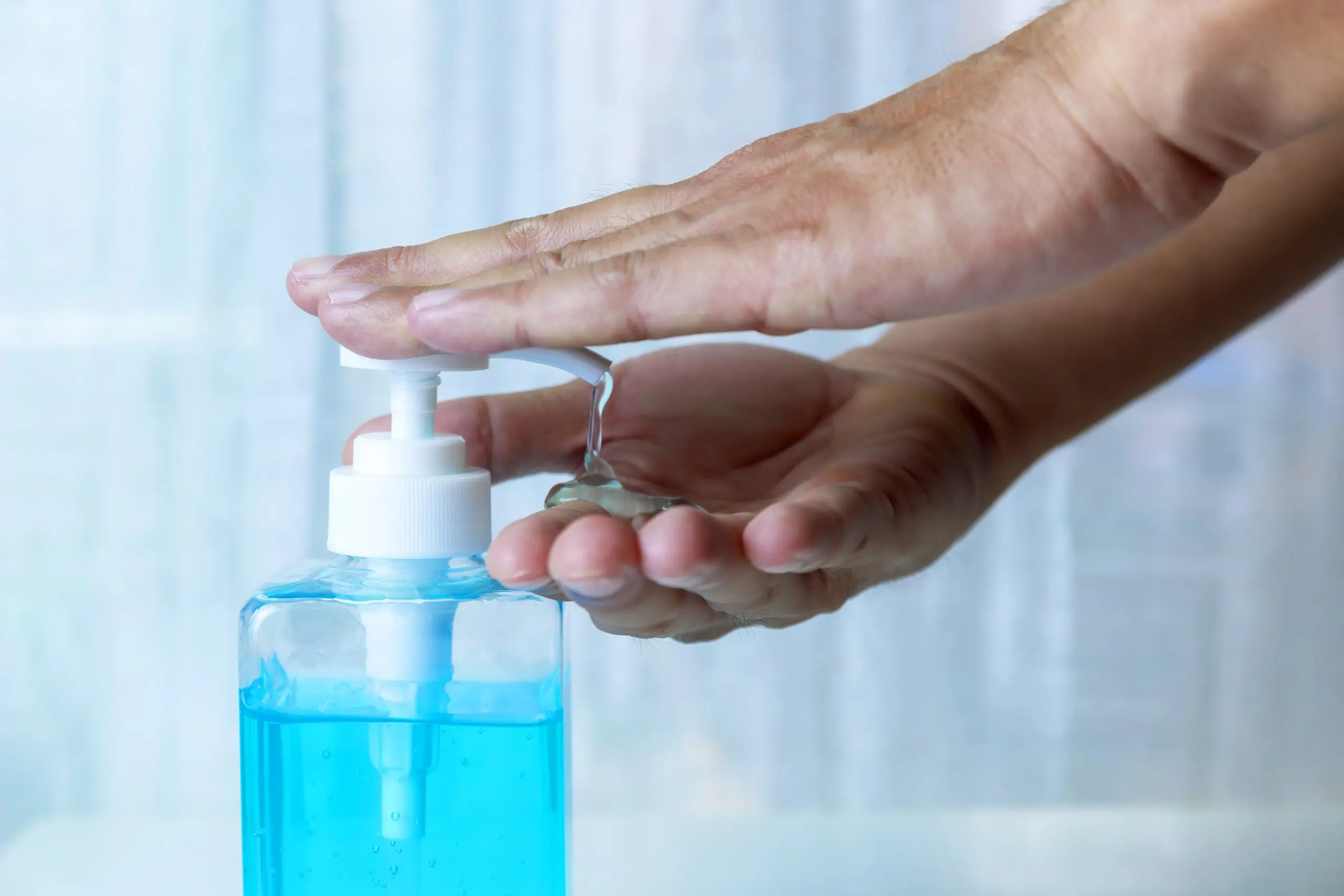Philippines Hand Sanitizers Market Outlook 2035 close-up-hand-man-using-hand-sanitizer-gel-scaled