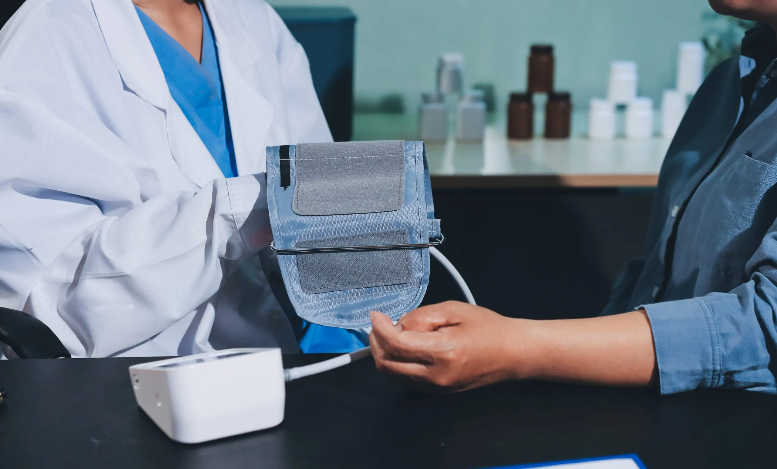 USA Blood Pressure Monitors Equipment Market Outlook 2035 closeup-doctor-checking-blood-pressure-scaled
